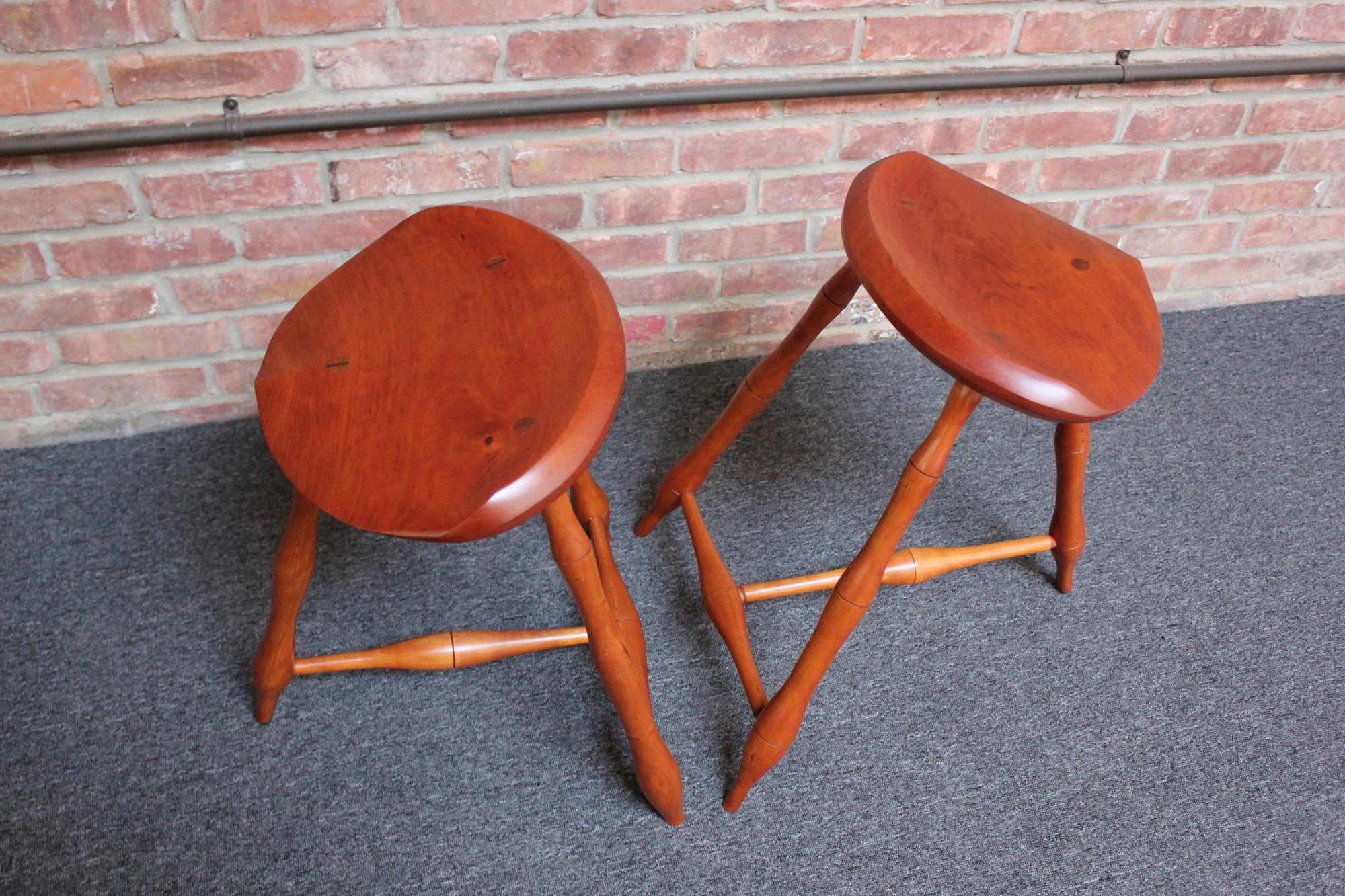 Hand-Carved Pair of Vintage Studio Craft Windsor-Style Three Legged Low Stools in Cherrywood For Sale