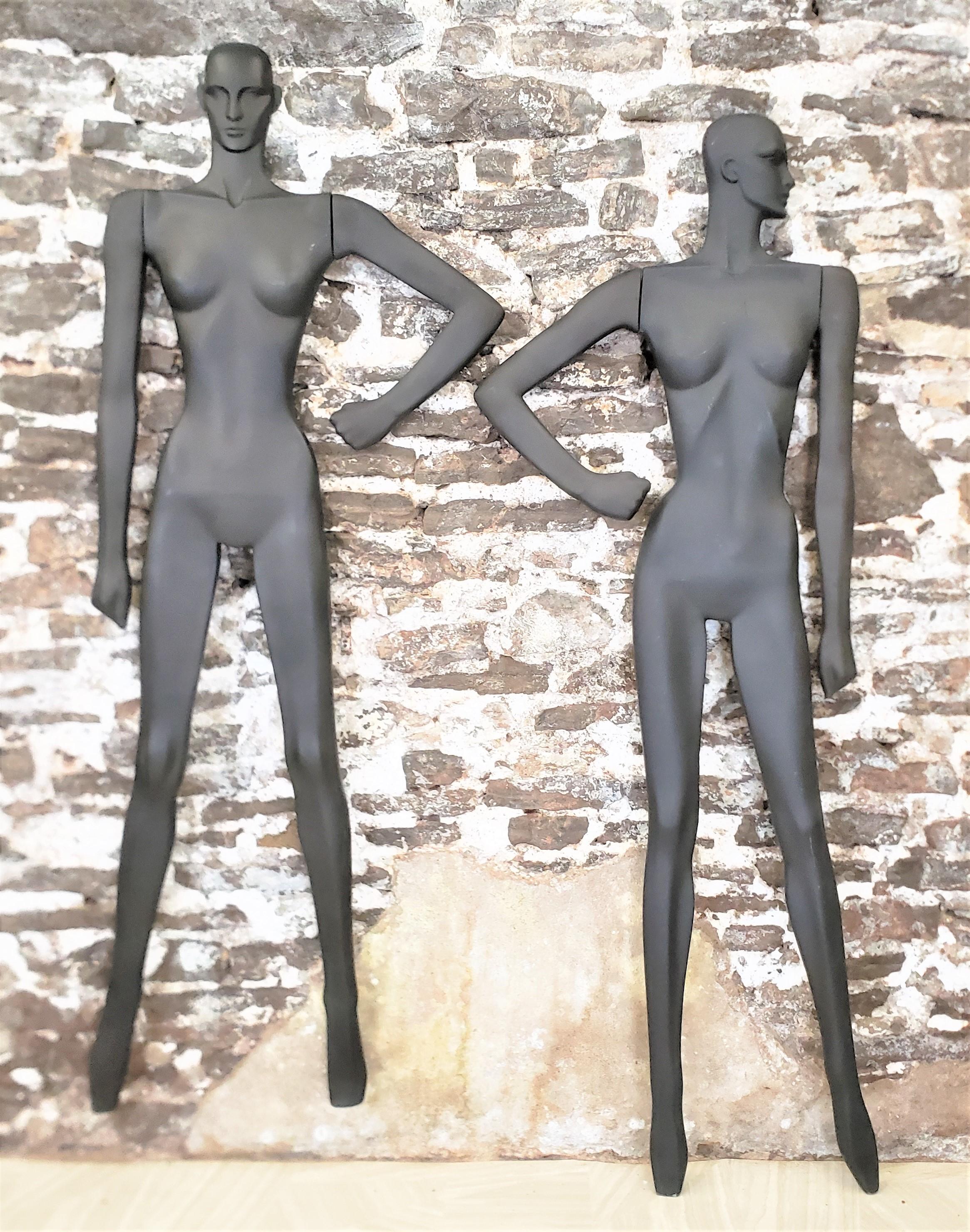 This pair of wall mounted sculptures are unsigned, but presumed to have originated from the United States and date to approximately 1970 and done in a Mid-Century Modern style. The sculptures are composed of a molded plastic and depict in
