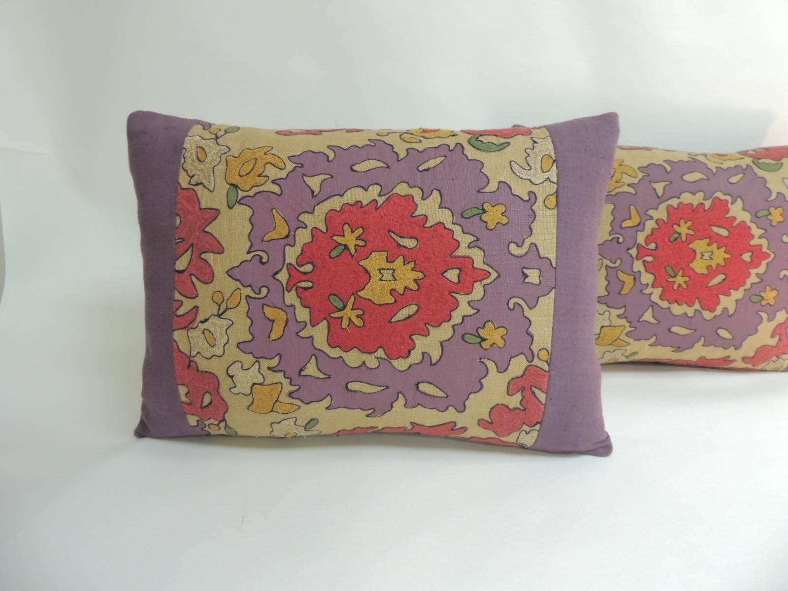 Pair of vintage Suzani embroidery purple decorative pillows
Pair of lumbar linen pillows framed with home-spun purple linen and same backings. In shades of purple, yellow, orange, ecru, green red, black and yellow.
 Decorative pillows handcrafted