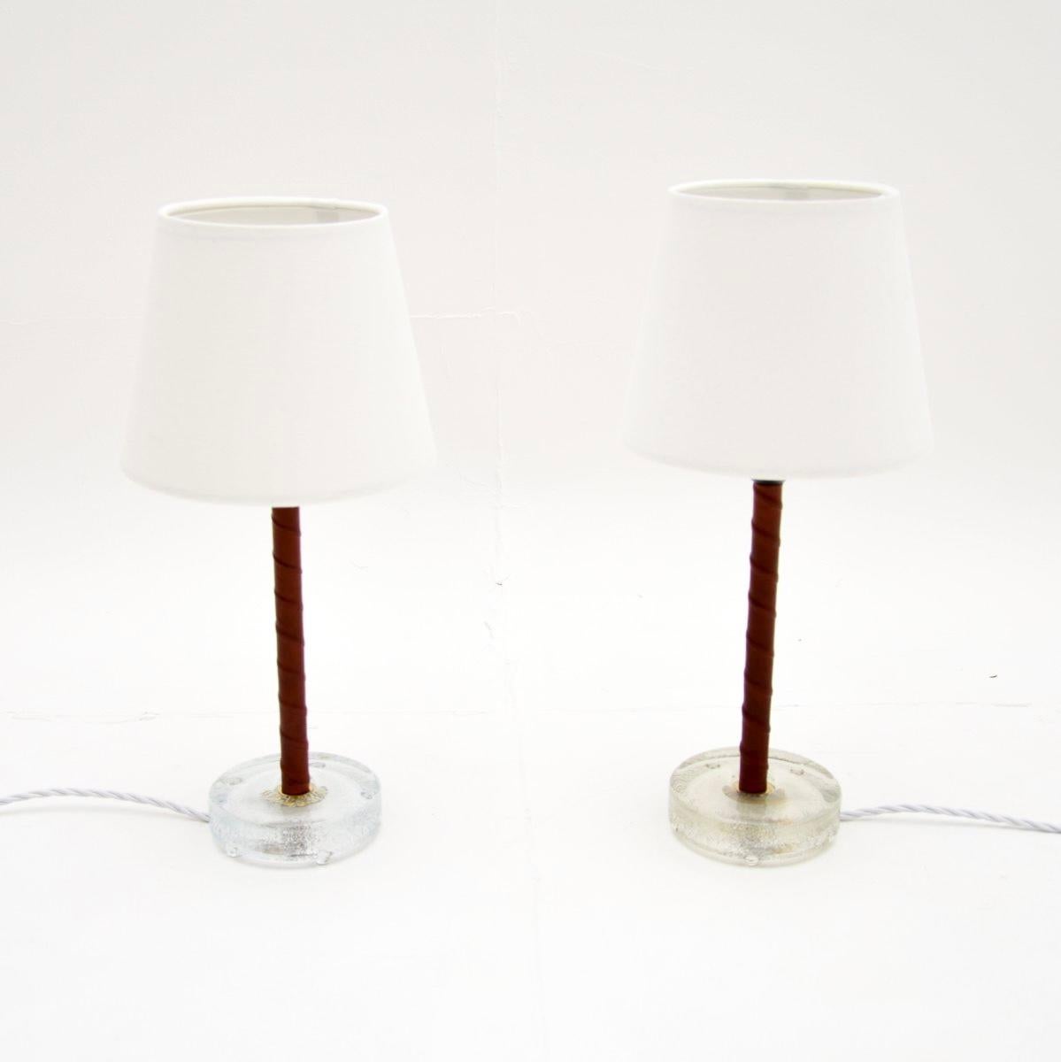 A stylish and extremely well made pair of vintage Swedish leather bound table lamps. They were recently imported from Sweden, they date from the 1970’s.

The quality is outstanding, the metal shafts are beautifully wrapped in twisted brown leather,