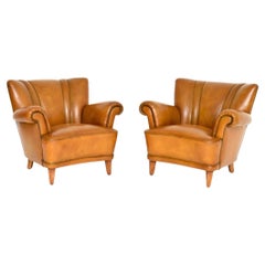 Pareja de sillones Club de cuero sueco vintage