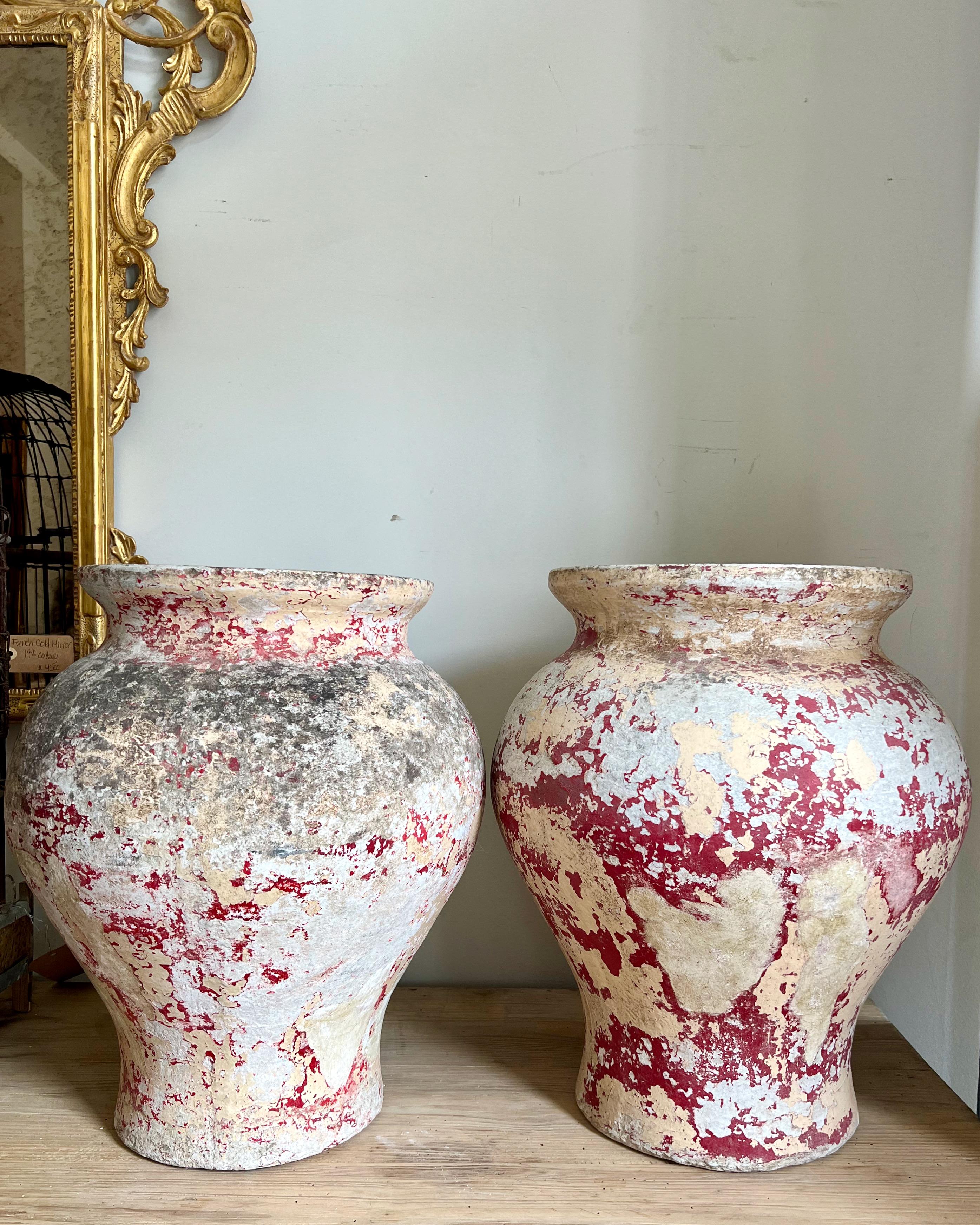 Pair of large-scale vintage vases with a fantastic weathered multi layered patina.
Made to Willy Guhl for Eternit 1960's

Top opening 11.50