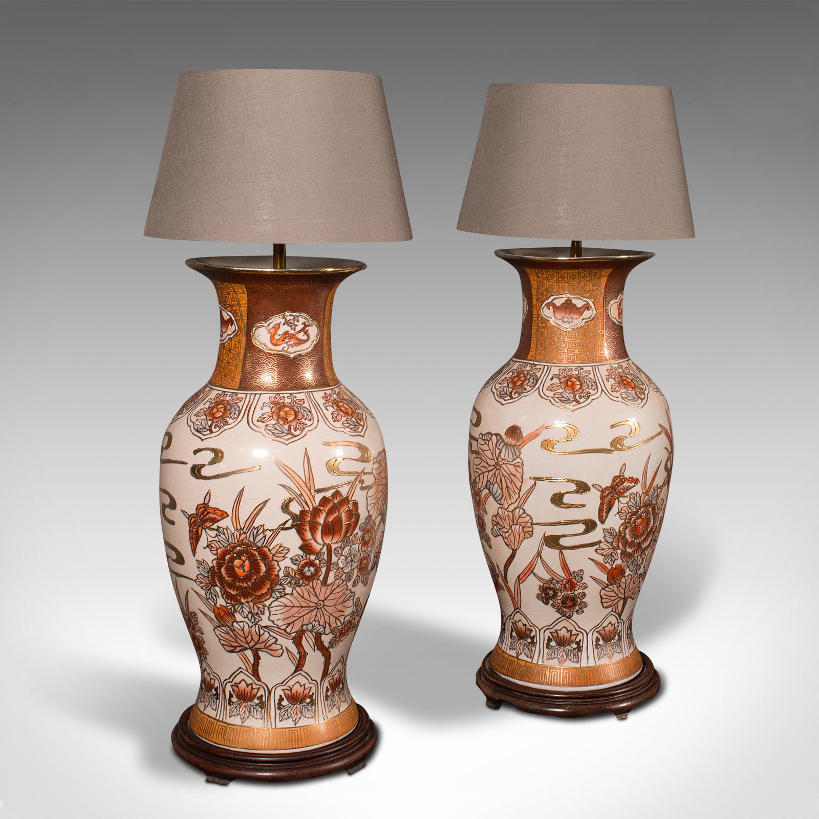 This is a pair of vintage table lamps. A Chinese, ceramic decorative light, dating to the late Art Deco period, circa 1940.

Strong deco taste to the foliate detail and mellow colours
Displays a desirable aged patina and in good order
Blush pink