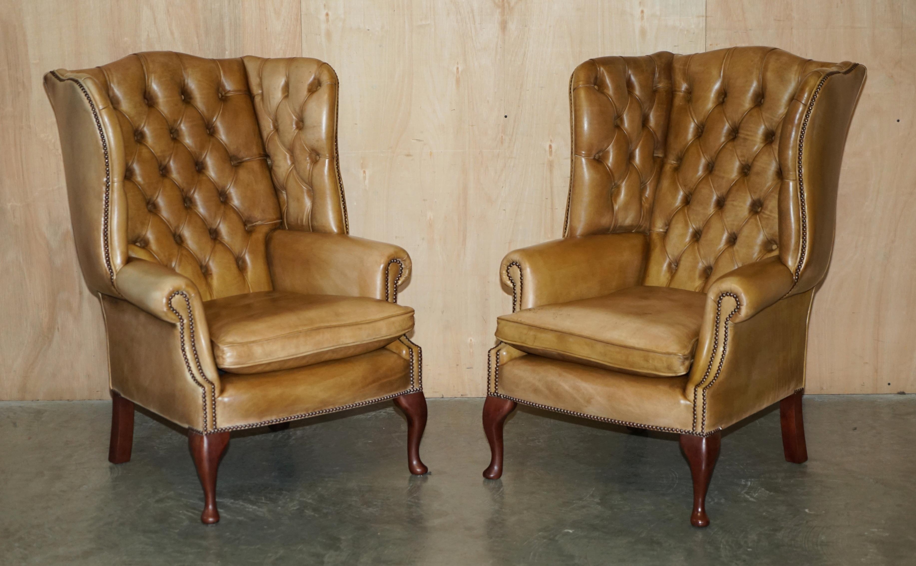Royal House Antiques

Royal House Antiques is delighted to offer for sale this stunning, lightly restored pair of vintage Chesterfield tufted English wingback armchairs with custom made matching footstools which are part of a suite

Please note the