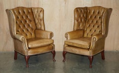 PAIR OF VINTAGE TAN BROWN LEATHER CHESTERFiELD WINGBACK CHAIRS WITH FOOTSTOOLS