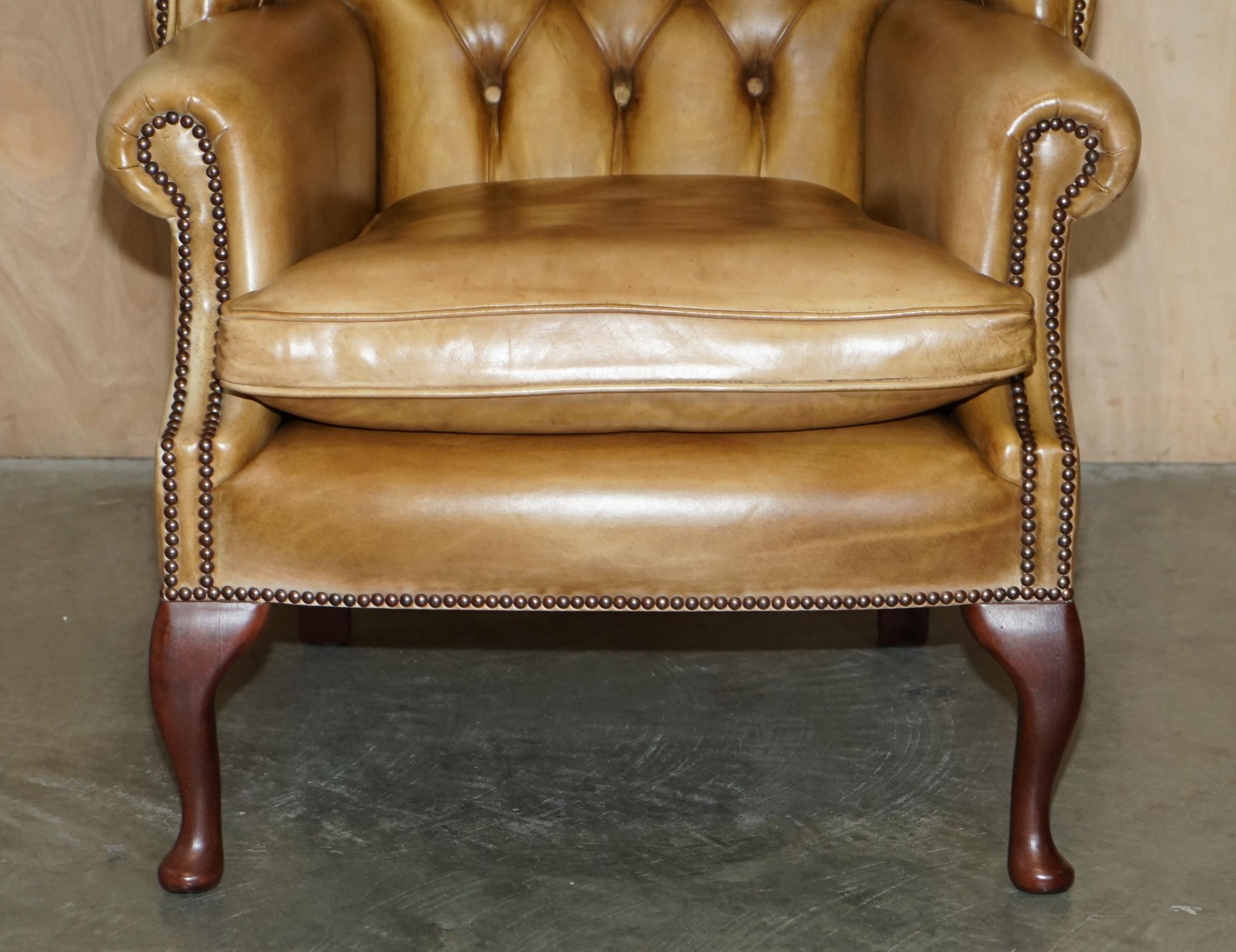 20th Century PAIR OF VINTAGE TAN BROWN LEATHER CHESTERFiELD WINGBACK CHAIRS WITH FOOTSTOOLS For Sale