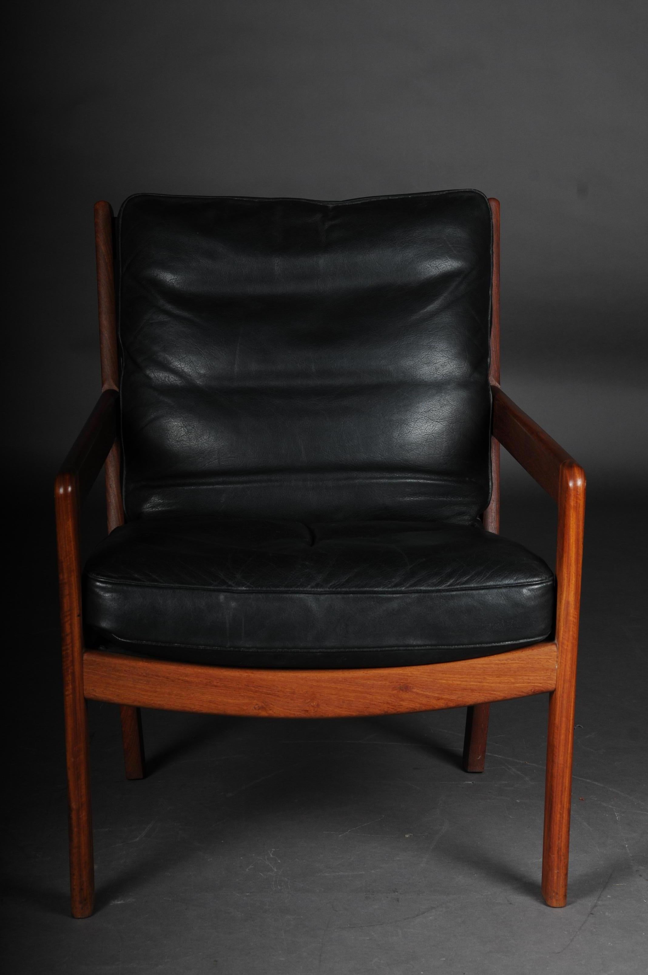 Pair of vintage teak armchairs, chairs, 1960s-1970s, Danish

Solid teak, simple and extremely comfortable armchair. Probably from the 1960s-1970s
The upholstered chair, convincing by its simple elegance, was originally based on the design of the