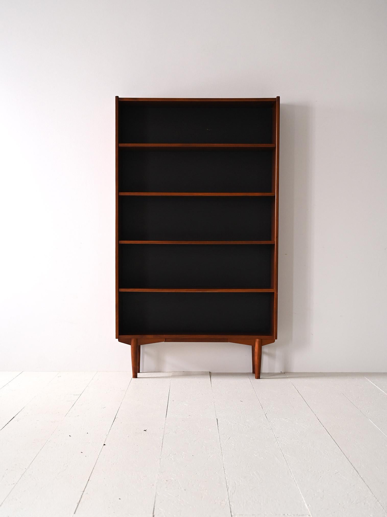 Scandinavian Pair of vintage teak bookcases with black back For Sale