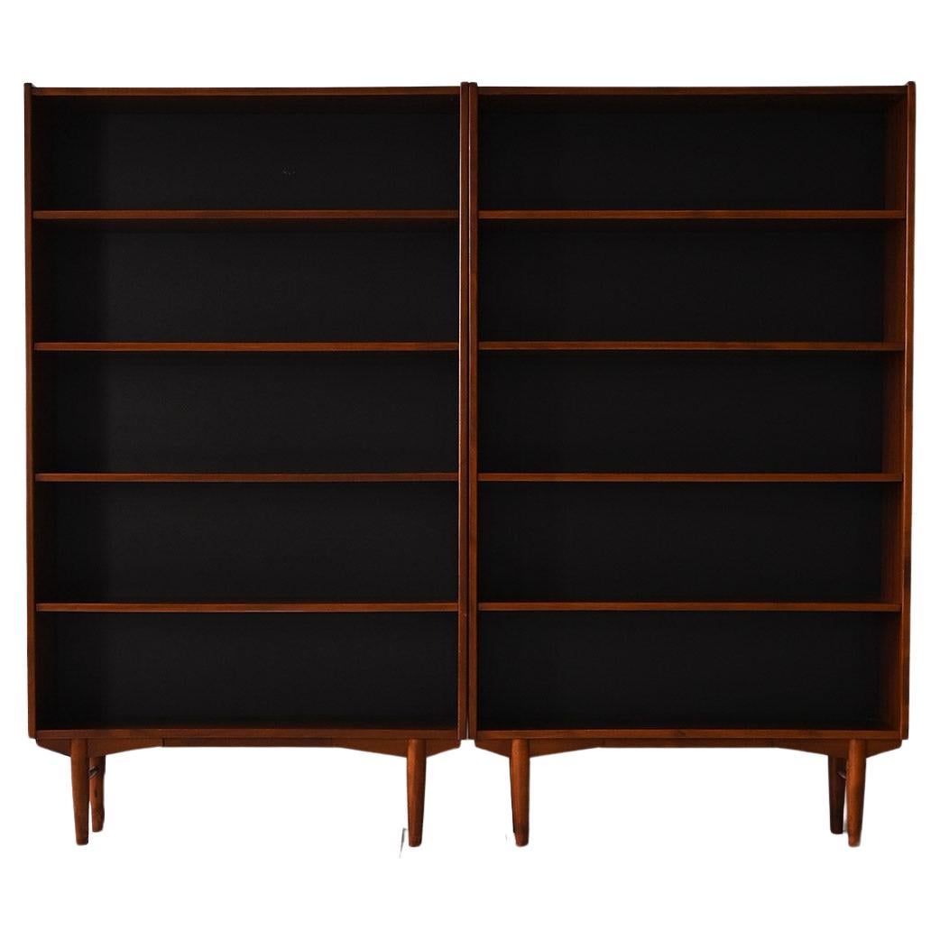 Pair of vintage teak bookcases with black back