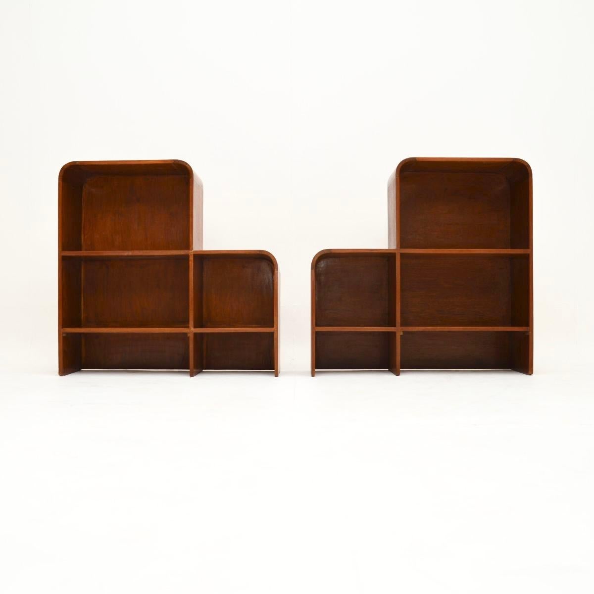 A smart and very stylish pair of vintage teak open bookcase cabinets. They were made in England, they date from around the 1950-60’s.

The quality is excellent, they are very well made with a quirky and useful design. They are a nice size with lots
