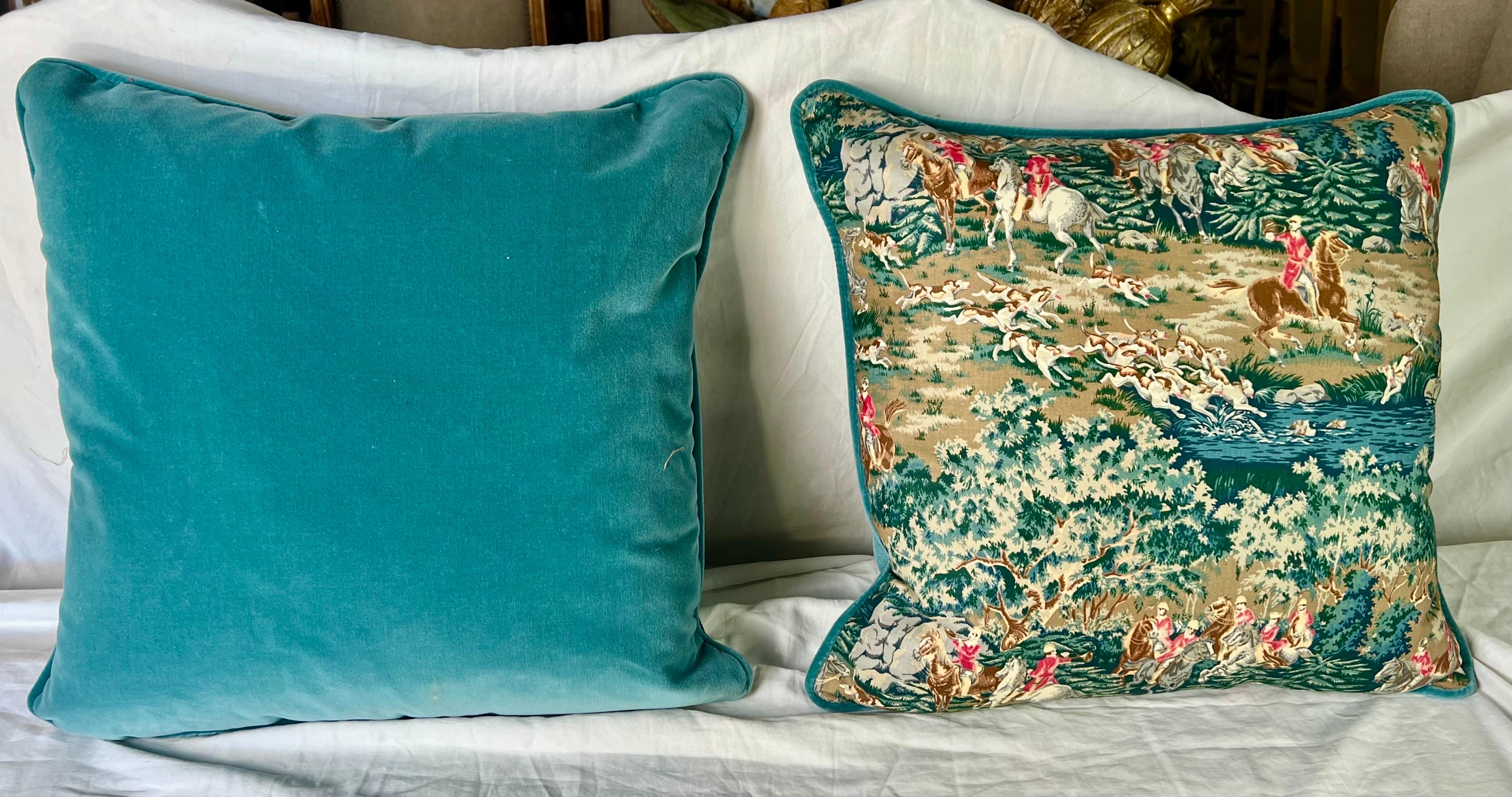 The English-style pillows featuring hunting scenes with horses and dogs in green, red and brown, along with green teal velvet backs and down-filled inserts, bring a touch of classic elegance and countryside charm to your decor.