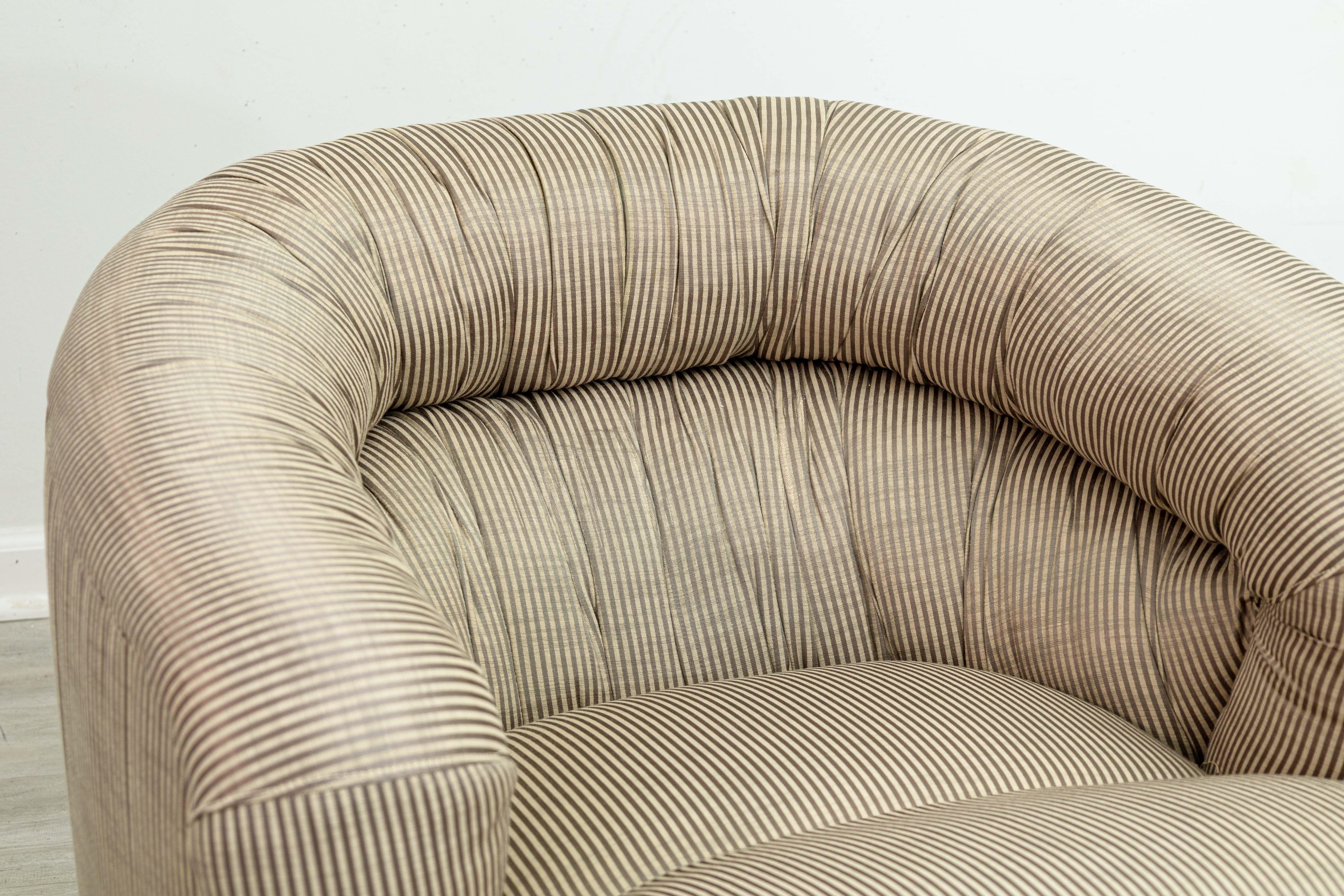 A pair of vintage Thayer Coggin swivel club chairs. This classic set of accent armchairs come from the furniture powerhouse Thayer Coggin, most likely with design work from Milo Baughman. These club chairs are very reminiscent of Baughman's classic
