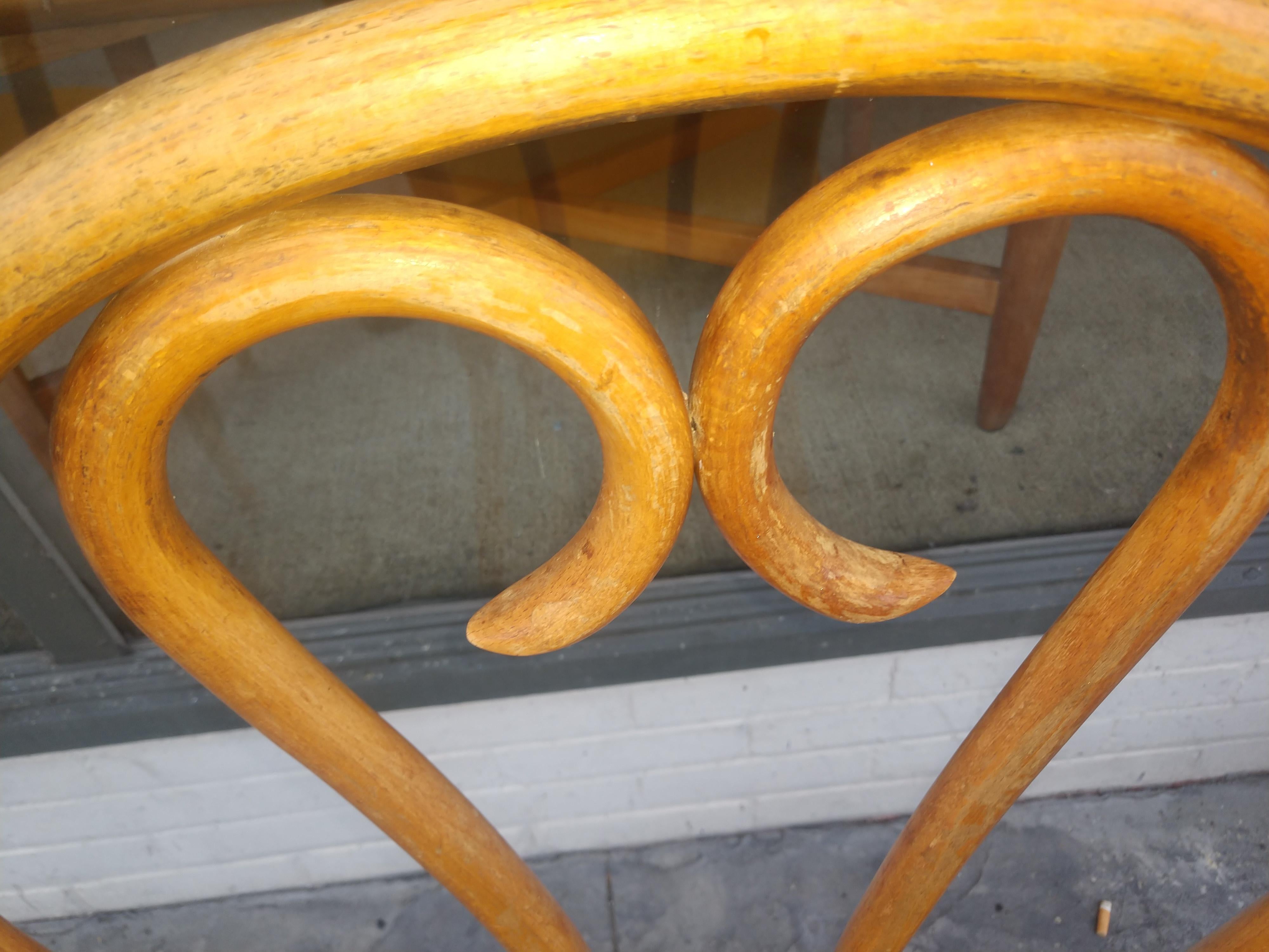 Beech wood cafe chairs with a yellow orange vinyl seat cover which is easily changed. Tight and sturdy with some minor wear. Sold and priced as a pair.