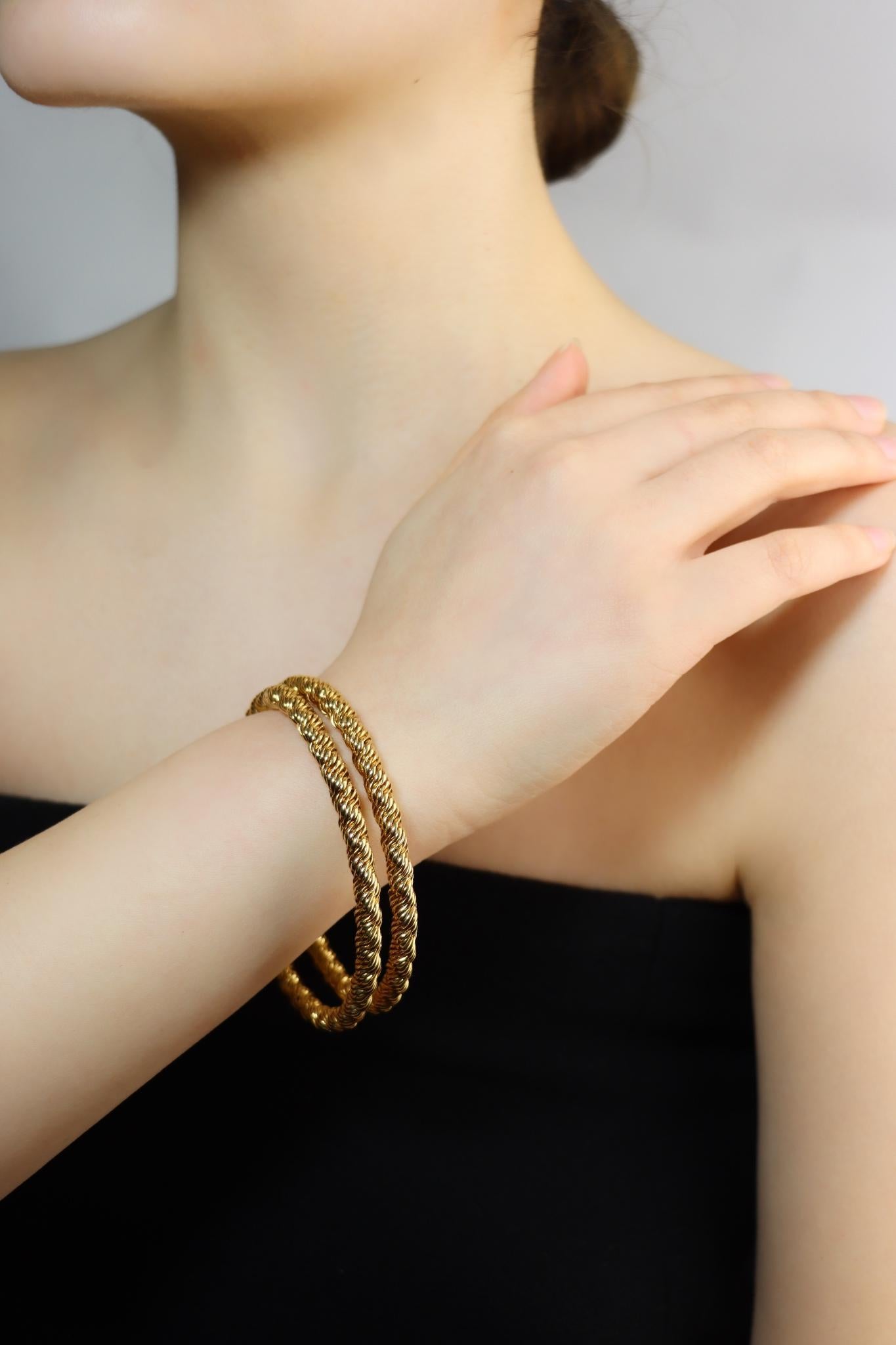 Pair of Vintage Tiffany & Co. 18K Gold Twist Rope Bangles

Marked:
Tiffany & Co. 
FRANCE
18KT

Approximate Dimensions:
20.2 cm (Length) 
0.4 cm (Width)
67.7 grams in weight.
