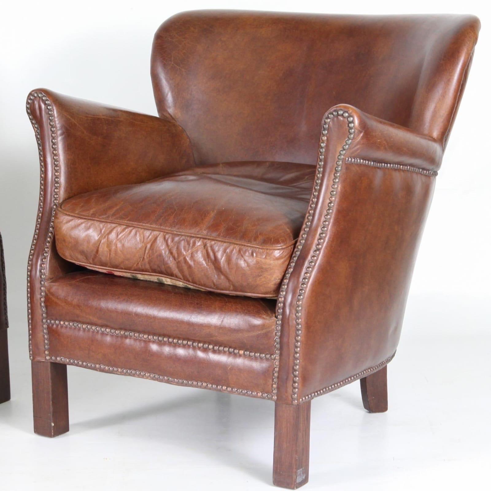 Pair of tiny but comfortable vintage leather club chairs. Very good condition 