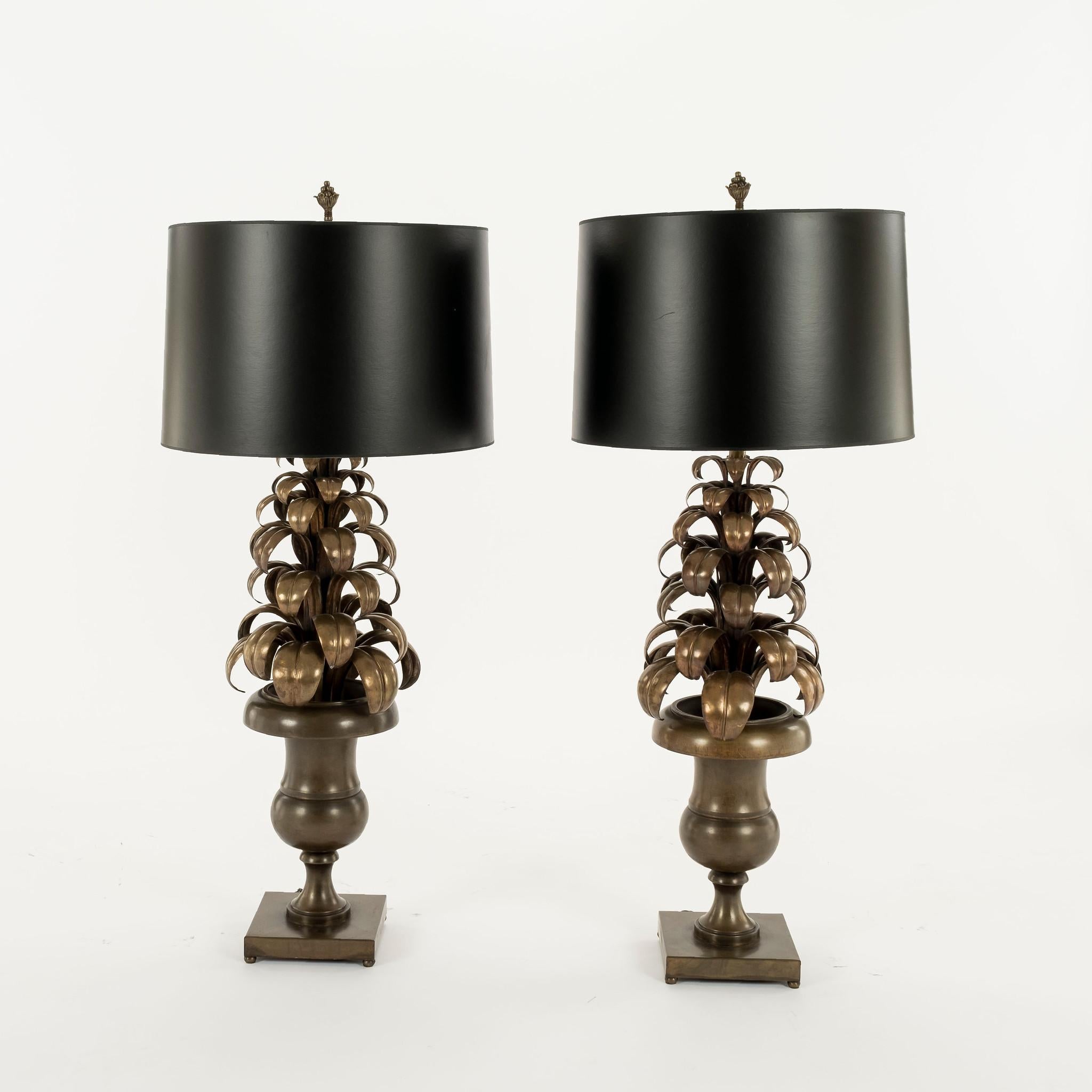 Pair of vintage tole bronze palm lamps with black paper shades.