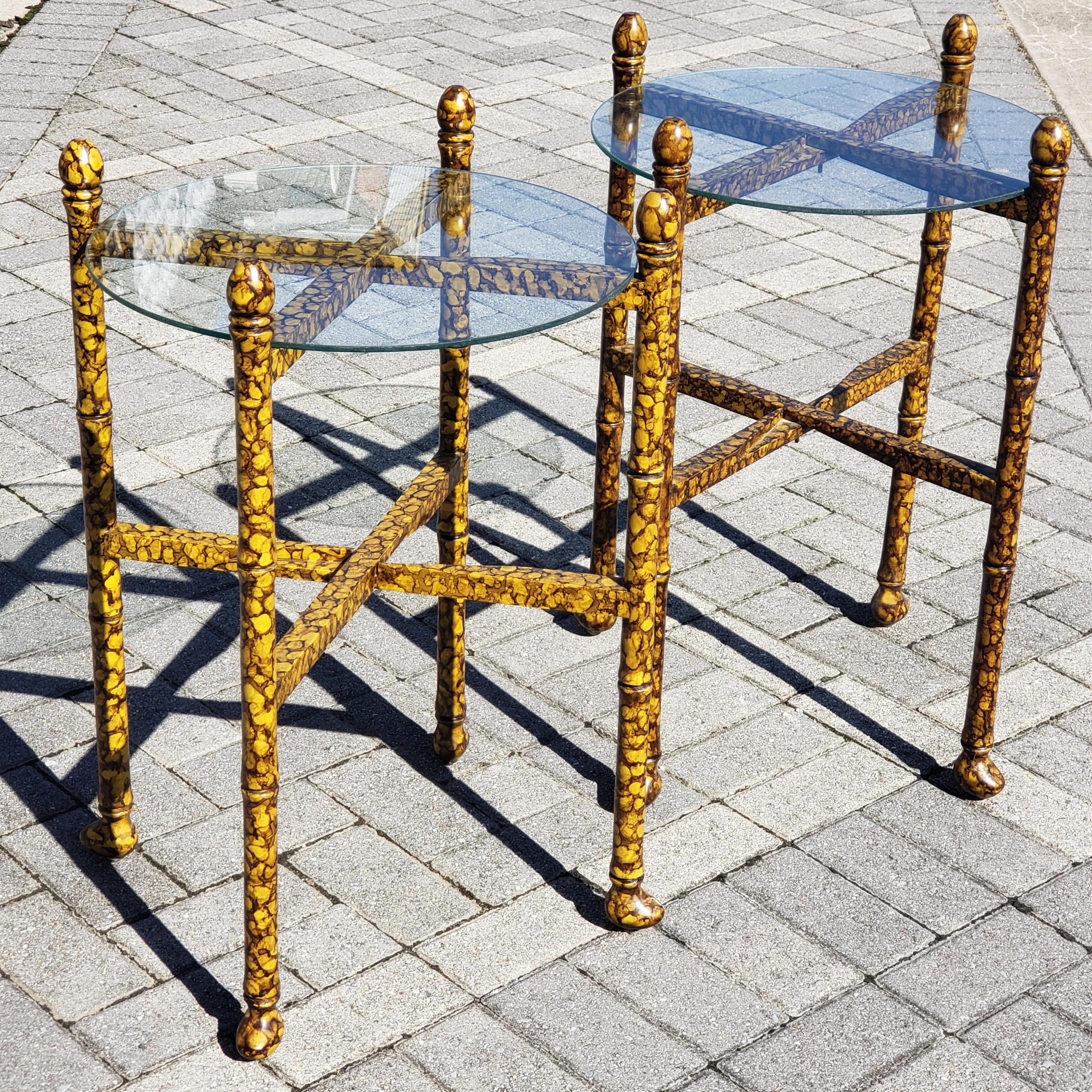 Wonderful pair of tortoise shell lacquer side/occasional tables. The glass tops are removable and the tables can be folded up for storage, campaign style. Even though they are designed to fold up they are strong enough to use for daily use.