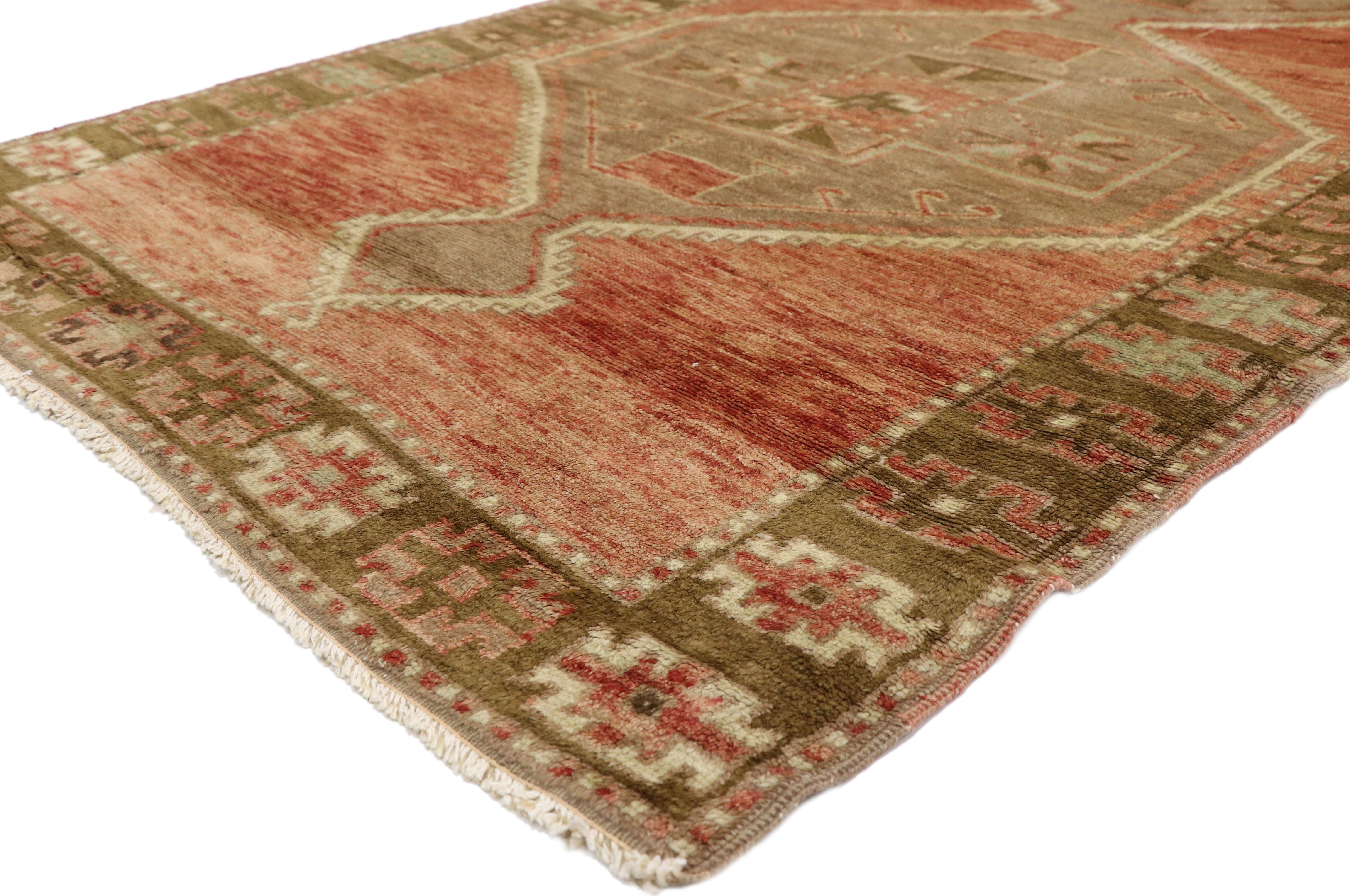 50442-50443 Pair of Vintage Turkish Oushak Hallway Runners with Mid-Century Modern Style. This pair of vintage Turkish Oushak carpet runners bring a warm and historical feel with their traditional modern style. Captivating large-scale medallions are