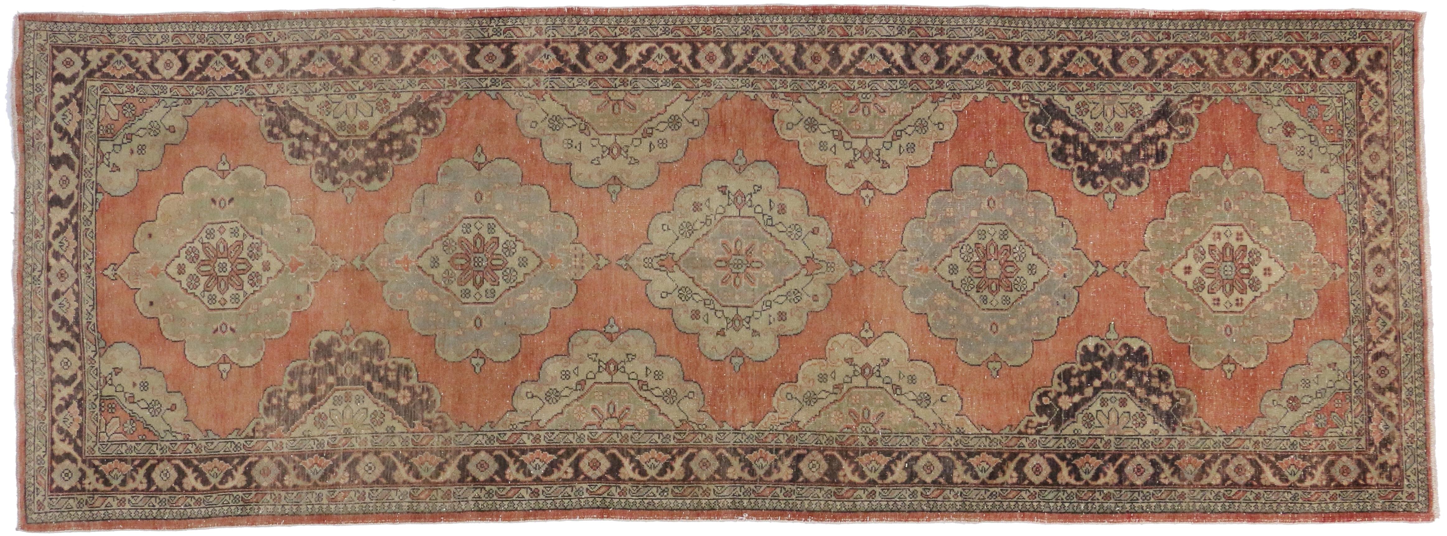 51142-51149 Pair of Vintage Turkish Oushak Gallery Rugs, Matching Hallway Runners. This pair of matching vintage Turkish Oushak gallery rugs each feature five lobed floral medallions spread across abrashed terracotta field. Spandrels and