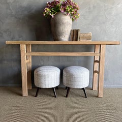 Pair of Vintage Turkish Rug Ottomans with Wood Legs