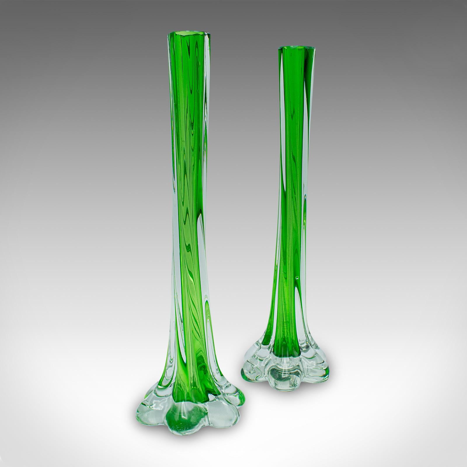 
This is a pair of vintage twist stem vases. A French, art glass flower sleeve, dating to the mid 20th century, circa 1950.

Charming French glassware with playful, attractive forms
Displaying a desirable aged patina and in good order