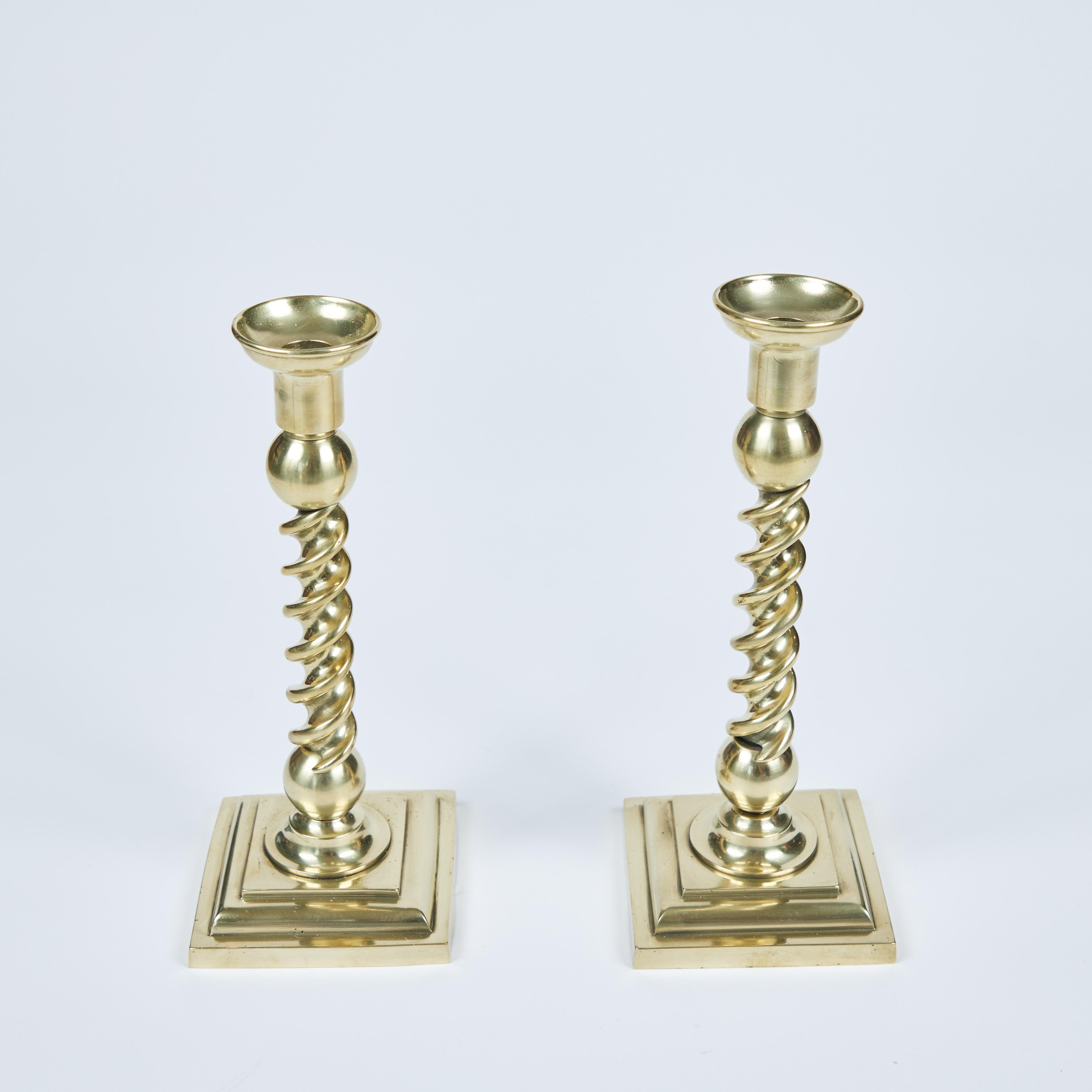 Want to make a statement? This pair of vintage twisted candlesticks are the perfect accent. Made from gorgeous heavy brass that has been newly polished in a rich satin finish, they have a strongly defined twisted stem based by a ball detail on top