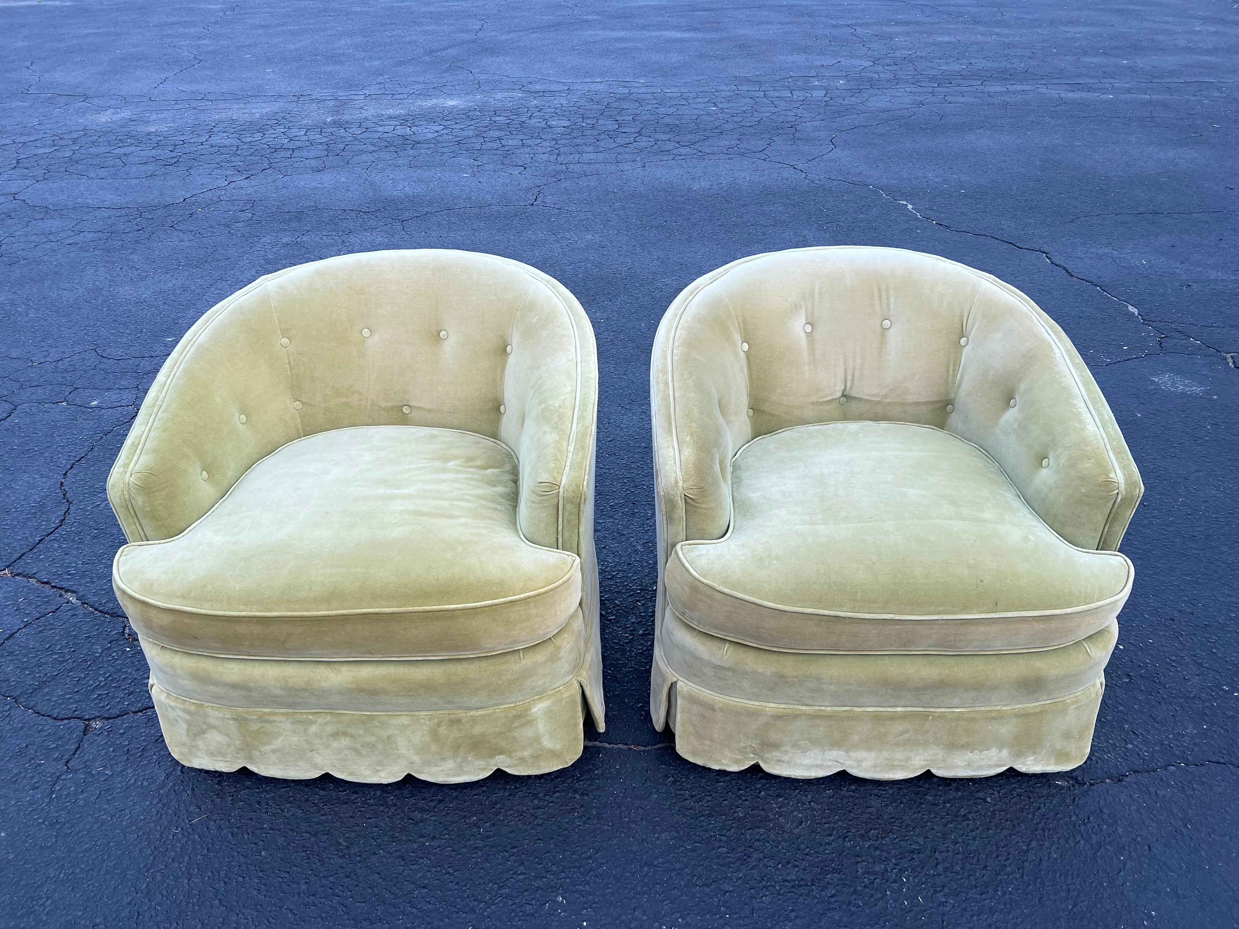 Pair of Vintage Velvet Henredon Swivel chairs. Soft sage green velvet upholstery with some button accents .Topped off with an amazing awning skirted base. Very Dorothy Draper. Heavy solid construction to these amazing swivel chairs. perfect for a