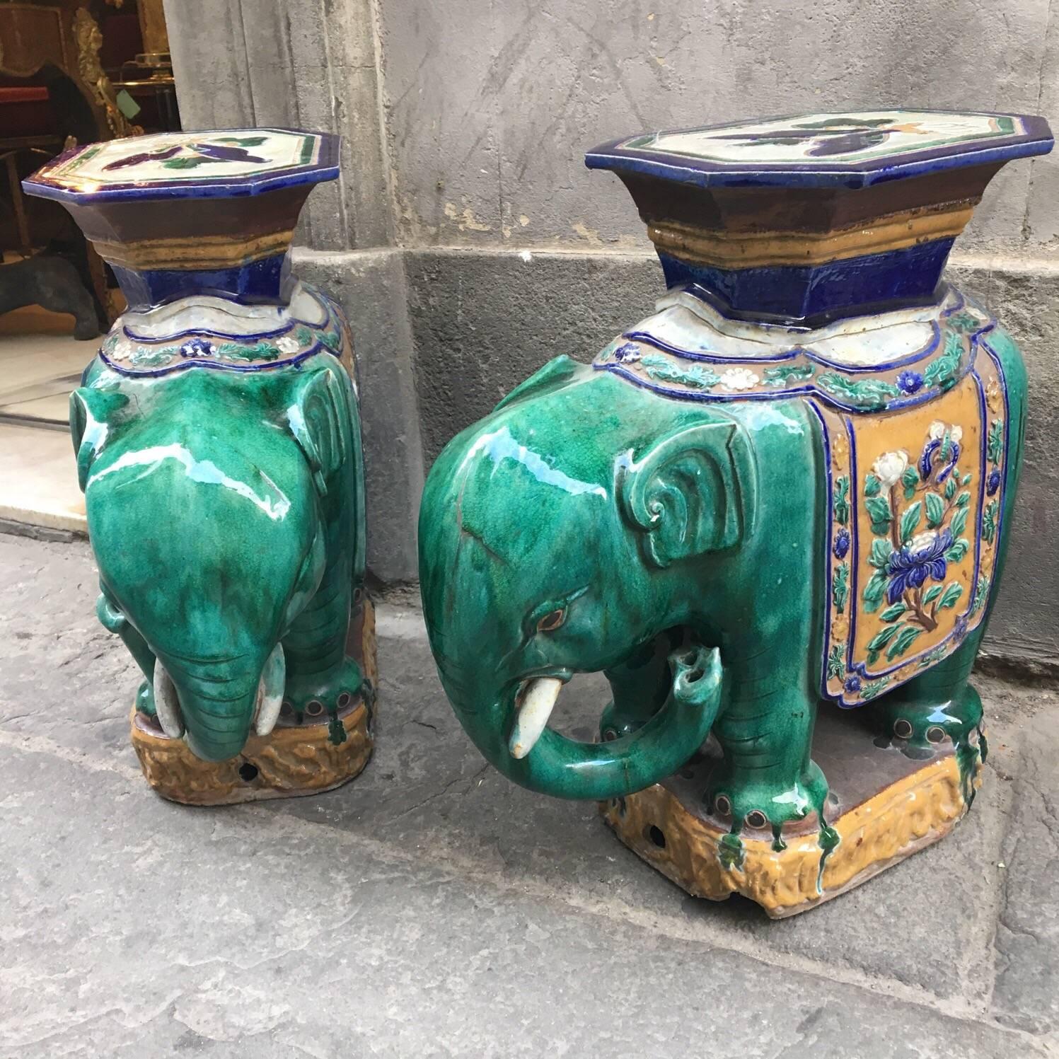 Pair of Vietnamese ceramic vintage elephant tables / garden plant stands. Excellent condition and made of ceramic porcelain. Vivid colors and details; they even have nose holes in the elephants' trunks.
These are great for indoor and outdoor use.