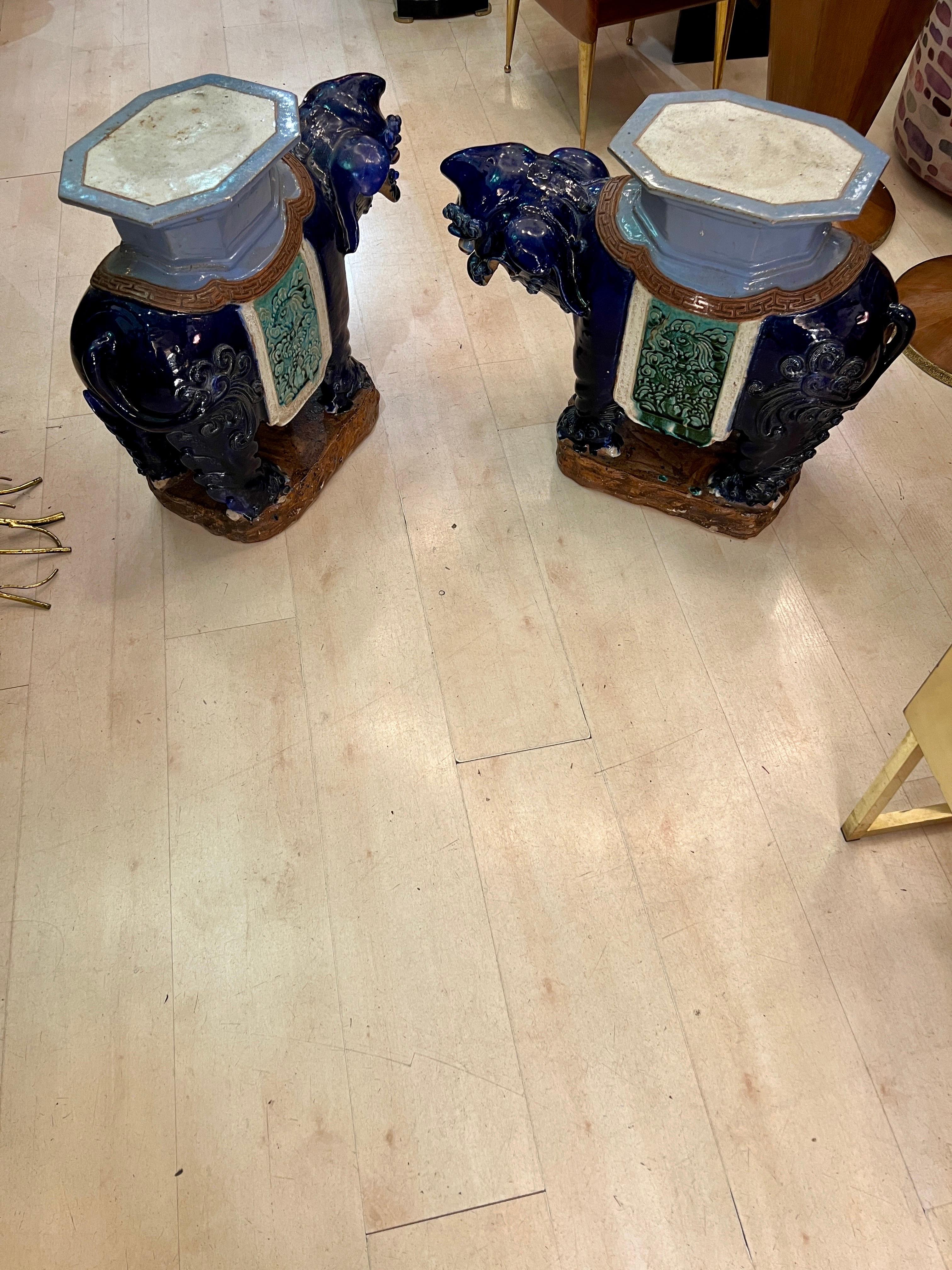 Pair of Vietnamese ceramic vintage Foo Dogs tables / garden plant stands. Excellent condition and made of ceramic. Vivid colors (blue and turquoise) and details.
These are great for indoor and outdoor use. Excellent as end tables, garden statues,