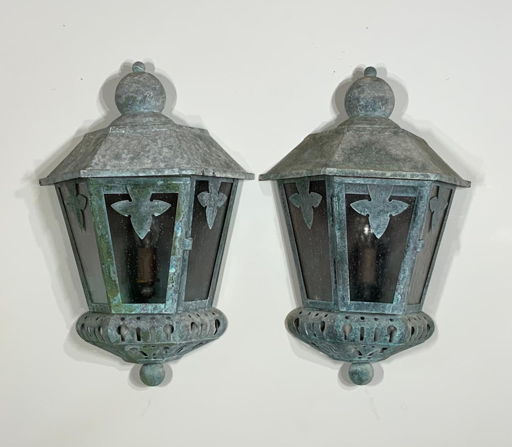 Beautiful pair of vintage wall lanterns Artistically hand crafted made from copper with one 60/watt light, and seeded acrylic glass like.
Exceptional original weather oxidised patina and colors, of turquoise green and gray.
Will look great indoor