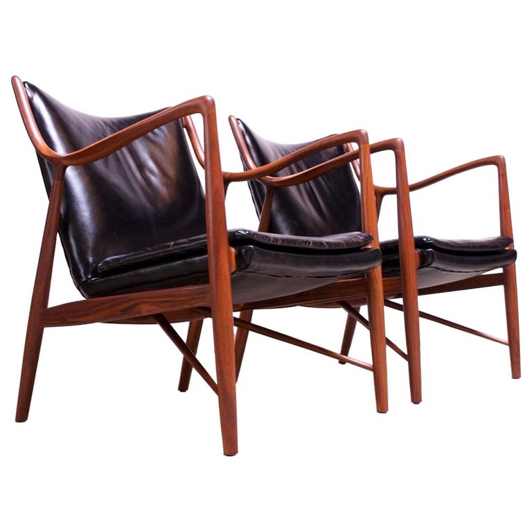 Finn Juhl for Baker pair of walnut and leather lounge chairs, ca. 1951, offered by Jarontiques