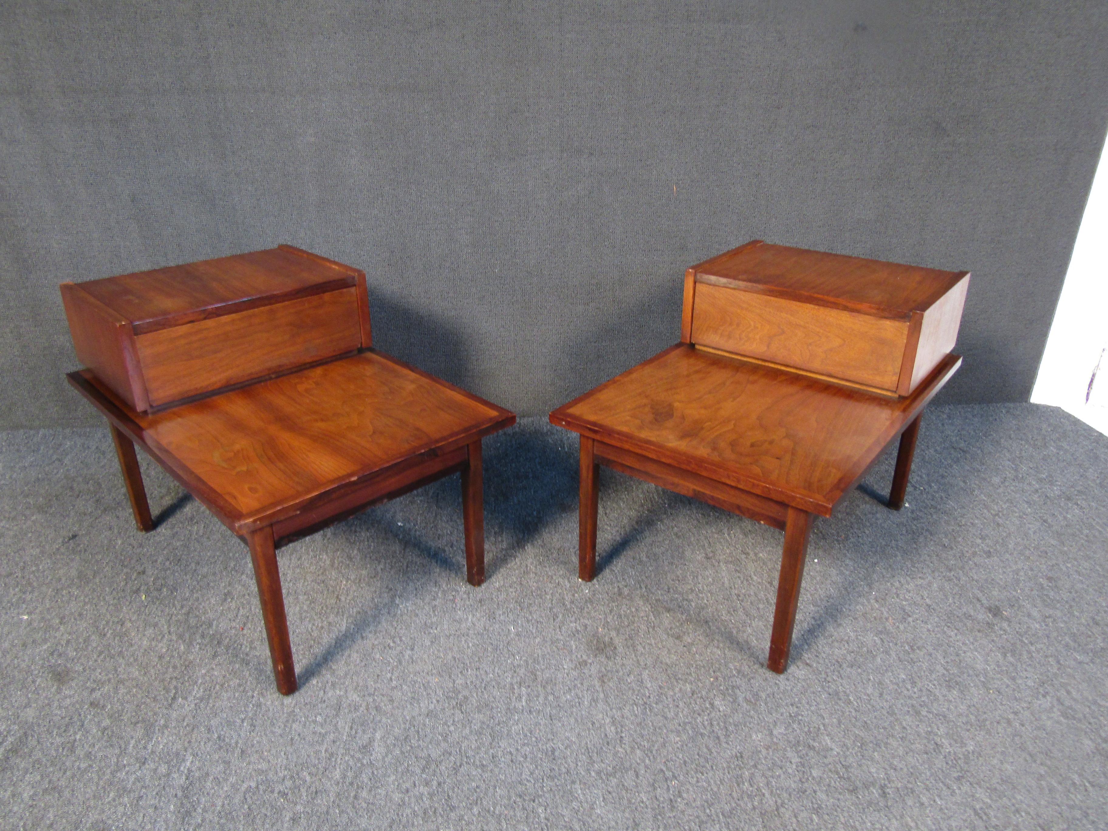 This elegant pair of walnut nightstands by Stanley combines an understated design with quality materials for a timeless Mid-Century Modern addition to any bedroom. Please confirm item location with seller (NY/NJ).