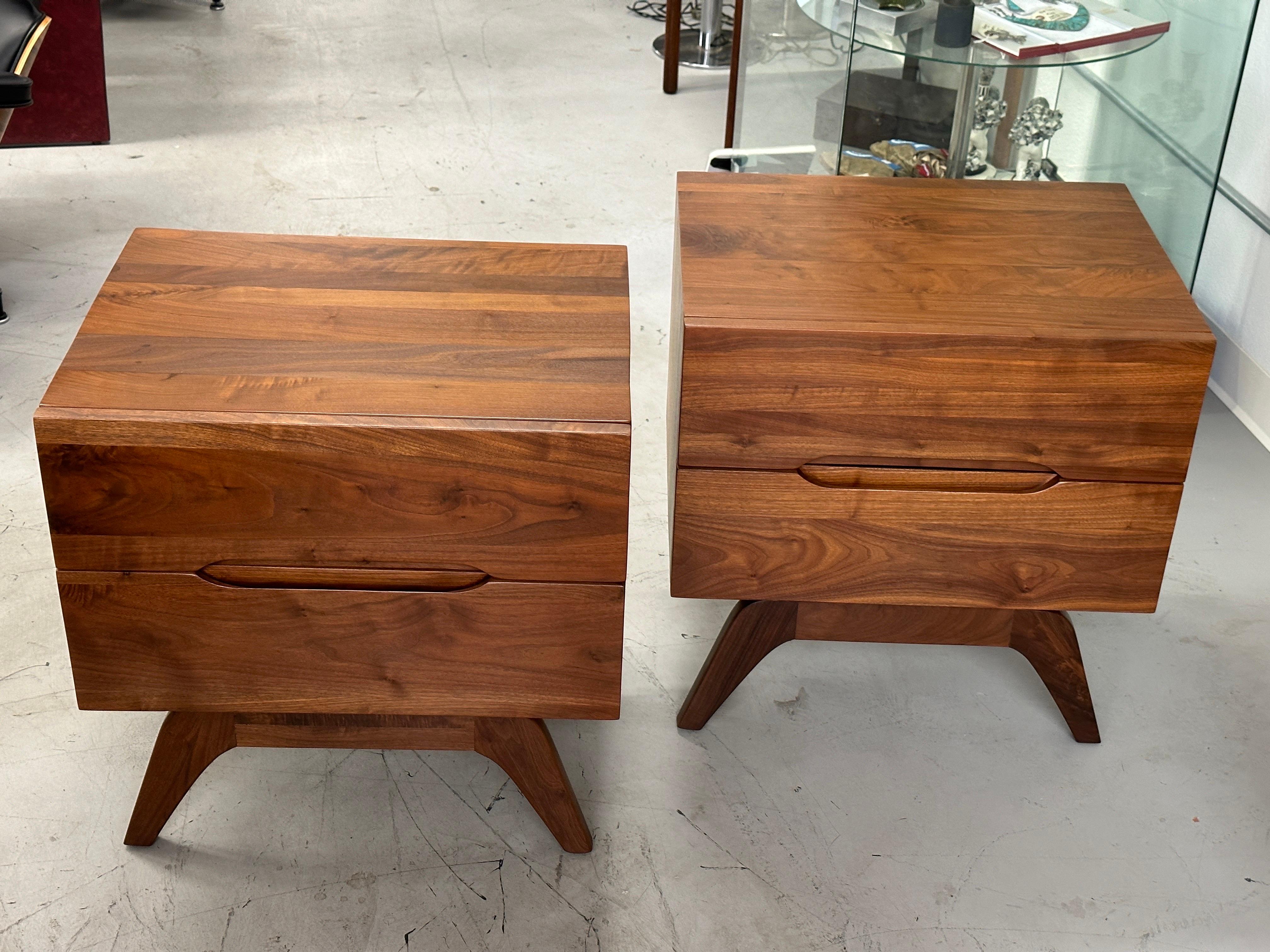 A pretty pair of solid walnut nightstands that have been beautifully refinished. These are solid pieces of walnut with oak secondaries. The back are some sort of composite. Attributed to Ace-Hi. In very good refinished condition, although there are