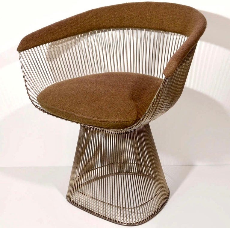 Pair of Warren Platner arm chairs featuring the award winning iconic design for Knoll. 
Made of nickel plated steel and upholstered in a muted brown wool fabric. Great conversation chairs with timeless design.