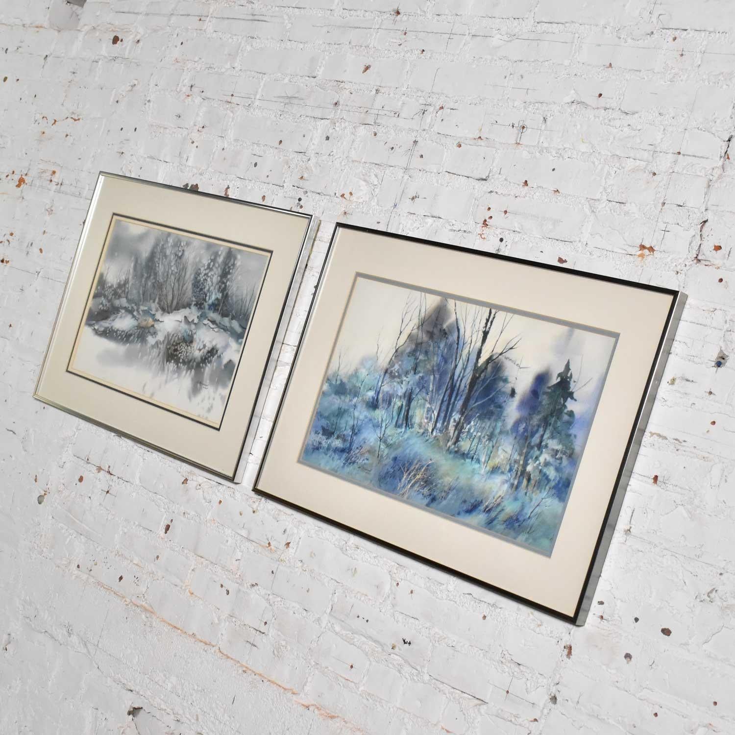 Handsome pair of watercolor paintings each depicting a different winter landscape by Dorothy M. Reece Kordash. They are in wonderful vintage condition and in their original frames. Please see photos, circa 1970s-1980s.

Wow! We are proud to be