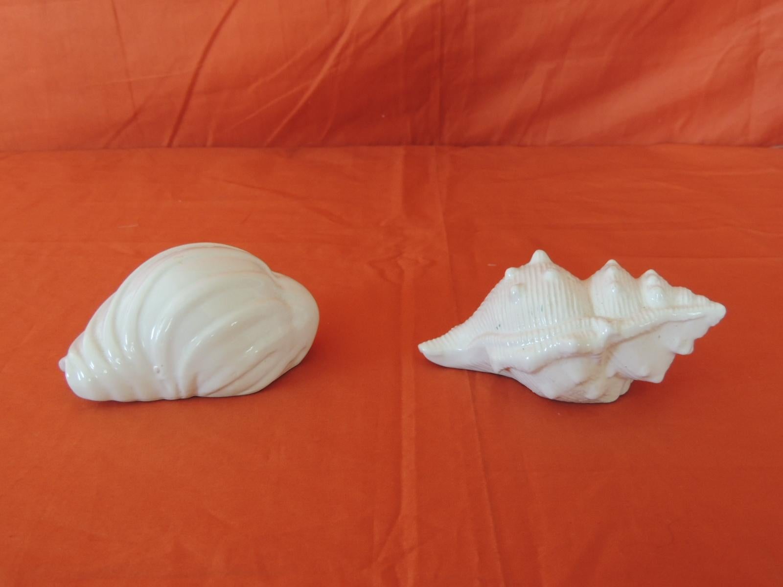Large Pair of Vintage White Seashells Salt and Pepper Shakers
Vintage white seashells salt and pepper shakers in white ceramic in the shape of conchs.
Size: 2 x 4 x 3 
&
 4 x 3 x 3