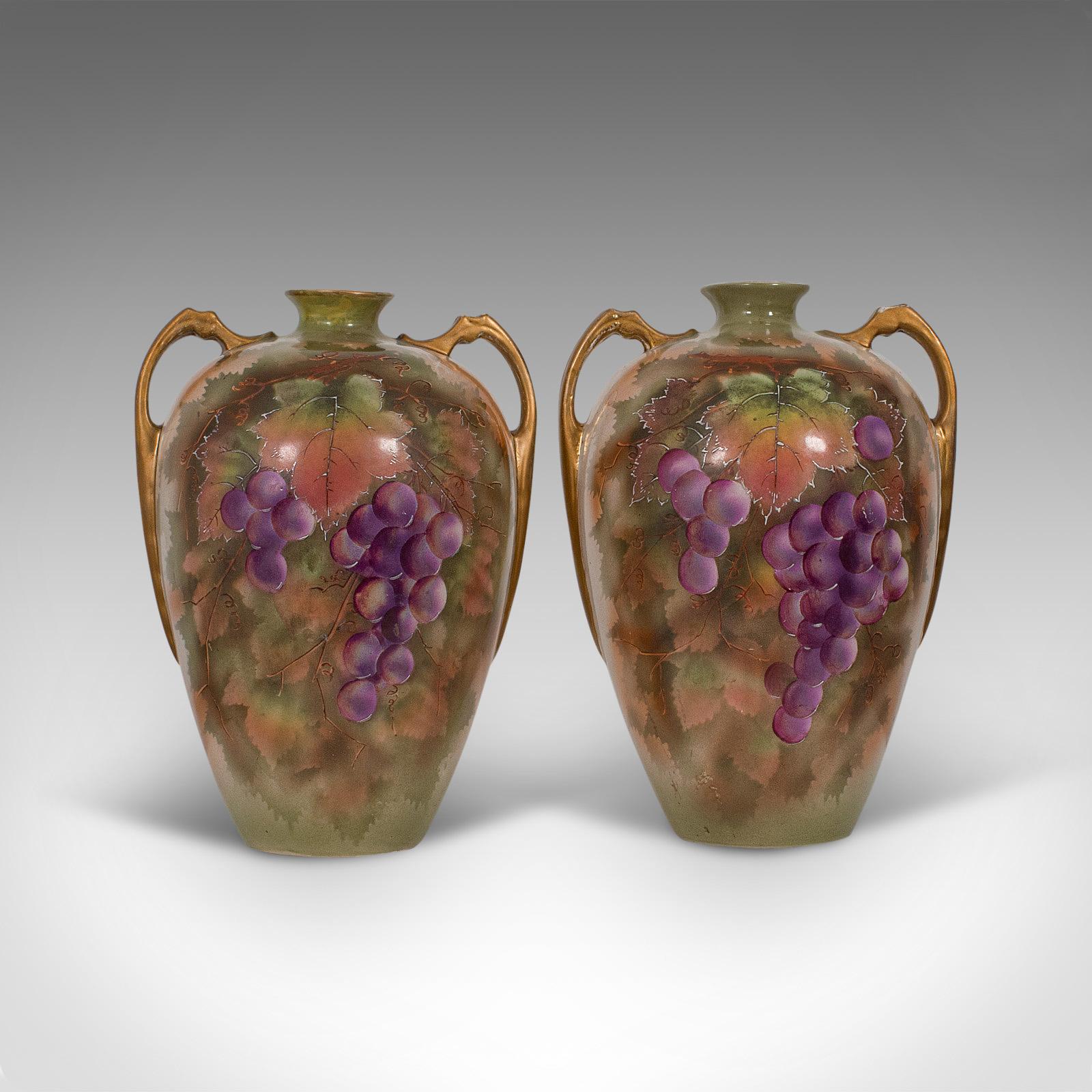 This is a pair of vintage wine Amphora. An English, ceramic decorative vessel with hand painted finish, dating to the mid-20th century, circa 1950.

Appealing English ceramics from the Potteries region
Displaying a desirable aged