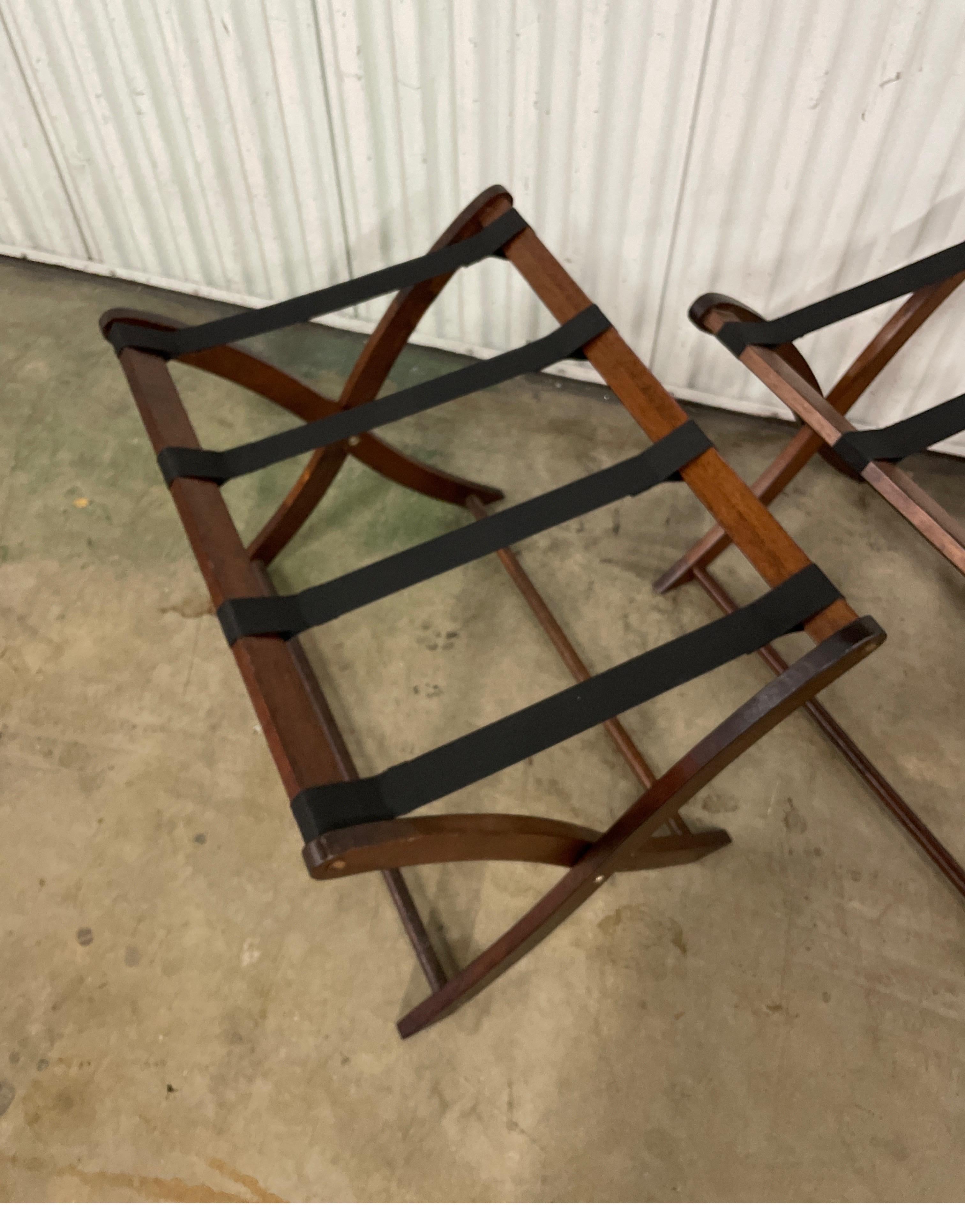 Pair of Vintage walnut colored wood & fabric luggage racks. When folded for storage they are 26.50
