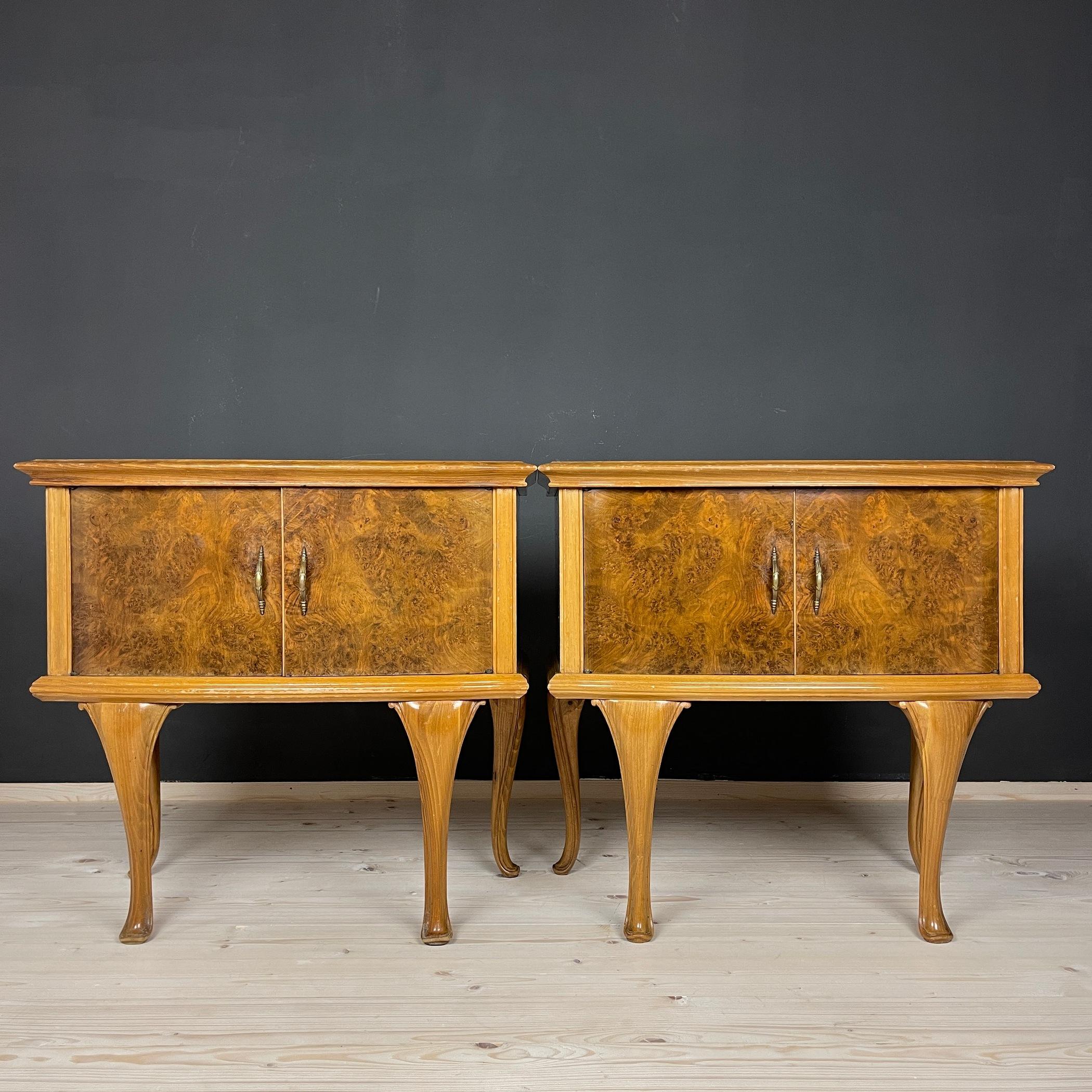 Pair beautiful bedside tables were made in the 1950s in Italy. Made of solid wood, plywood. Original fittings. They have been preserved to this day in good condition. Despite their venerable age, they look excellent. There are signs of wear and tear