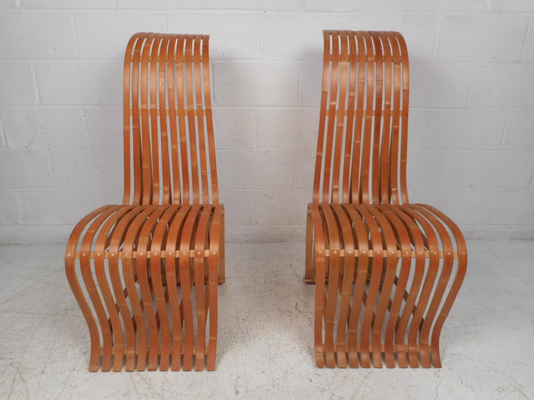 Interesting and unusual pair of wooden slat chairs. Quirky yet sturdy design. Great addition to any modern interior. Please confirm item location with dealer (NJ or NY).