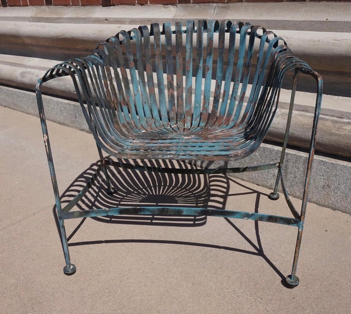 These vintage chairs have a story to tell and are from the 1950s. They were inspired by
Francois Carre's design although structurally, they are the inverse of Carre's design what with
their thicker metal tapered strips in a welcoming free floating