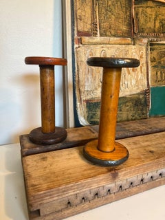 pair of vintage wooden spools