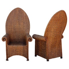 Pair of Antique Woven Rattan High Back Roll-Arm Chairs
