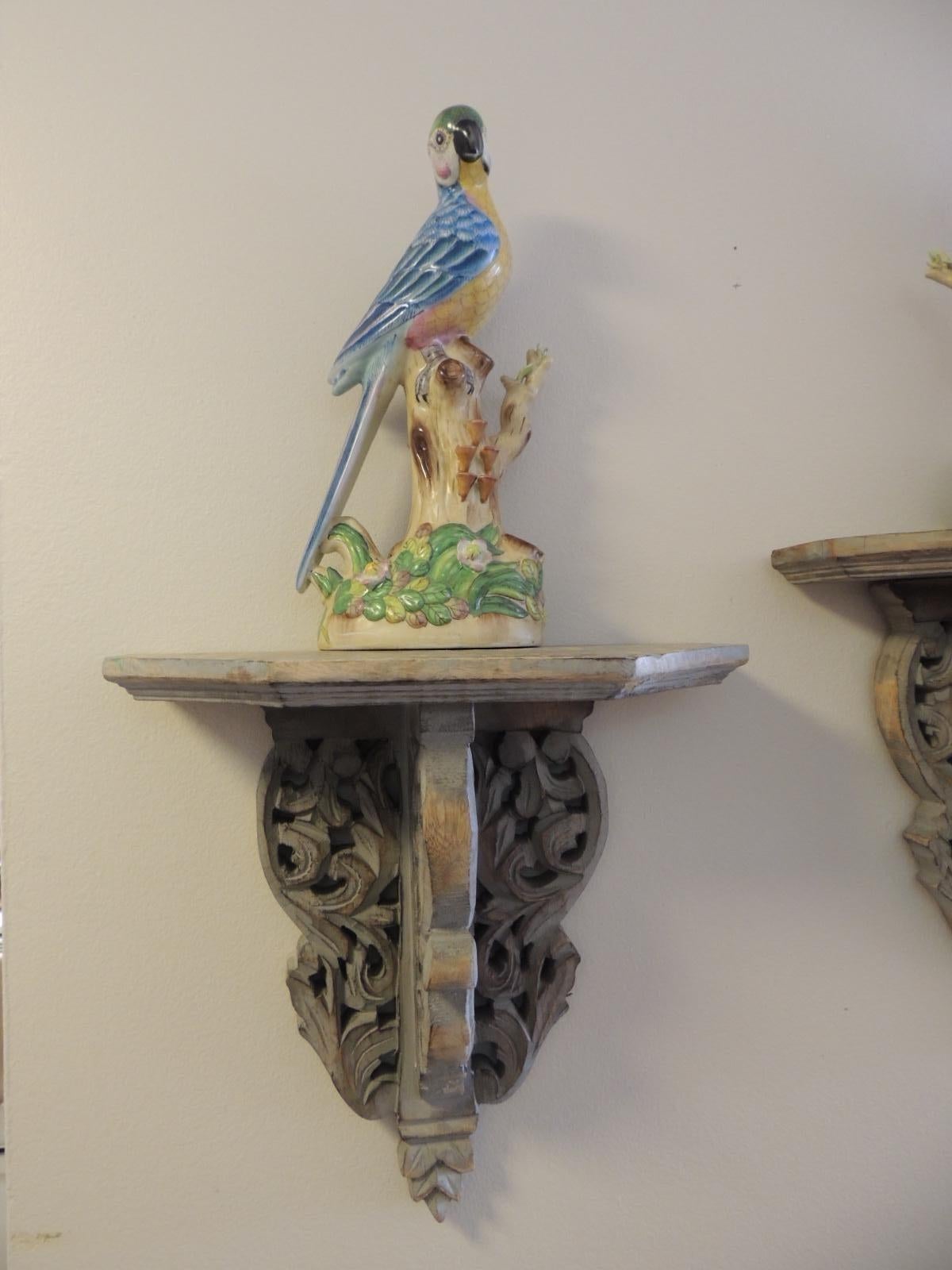 Hand-Crafted Pair of Vintage Yellow and Blue Chinese Export Parrots on Wood Brackets