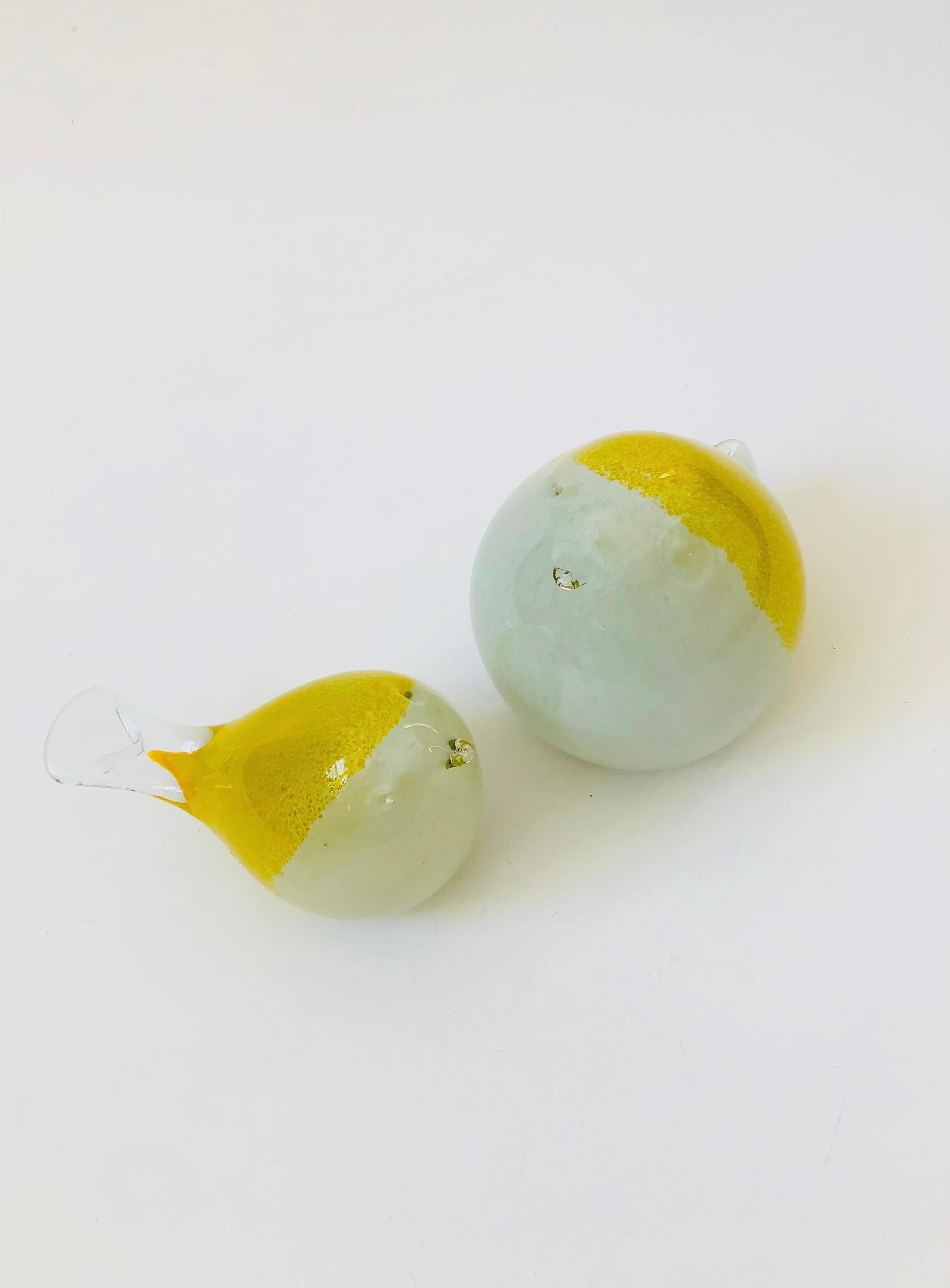 A pair of vintage art birds. Made of blown glass into rounded forms with yellow and white coloring. Nice larger size to use as statement pieces.
Measurements:
6.25