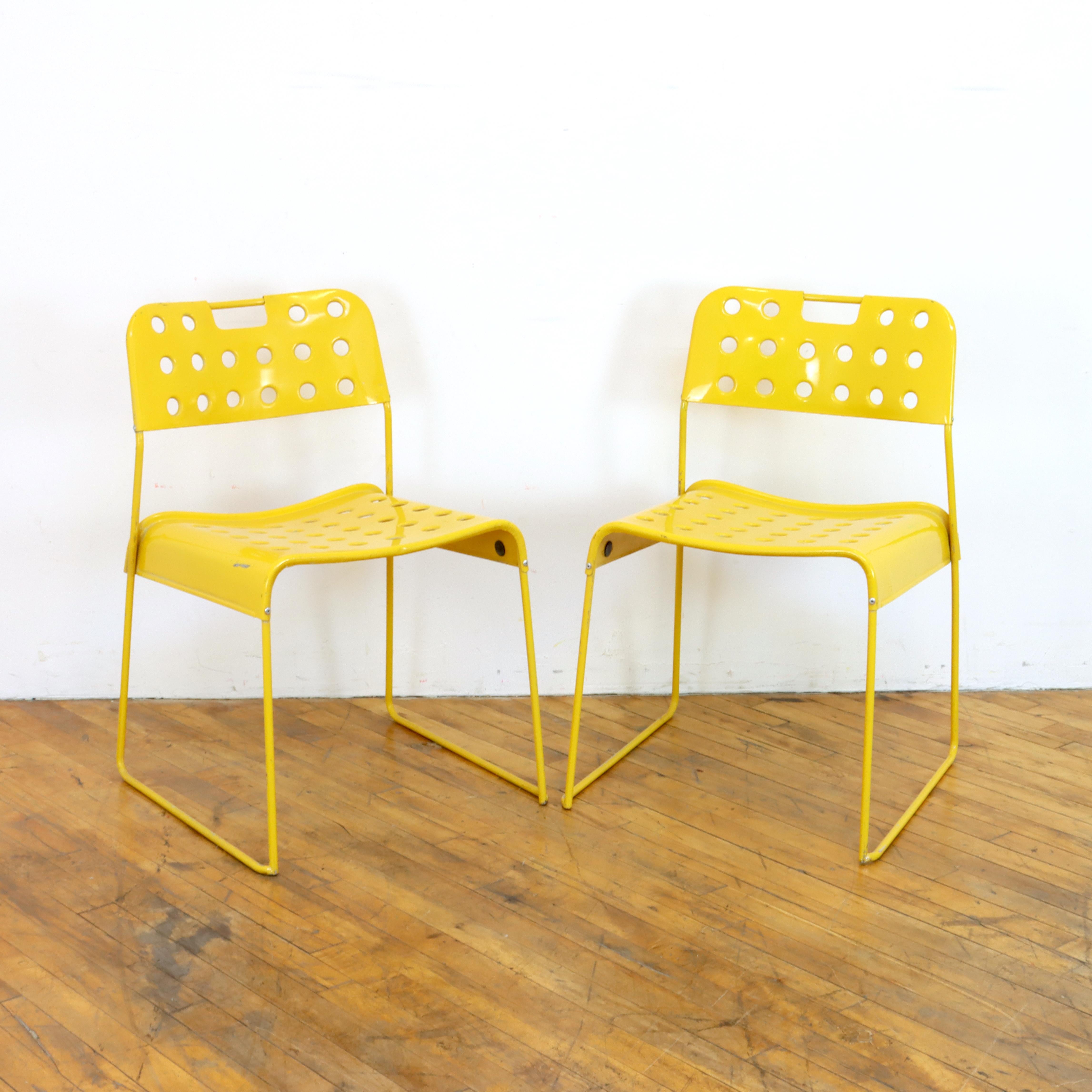 Pair of vintage 1970s Omkstak chairs in yellow by Rodney Kingsman for Bieffeplast. Wire frame and perforated 
metal seat and back. Can be used inside or out.  

18.5” W x 18” D x 30” H
Seat Height: 18”
