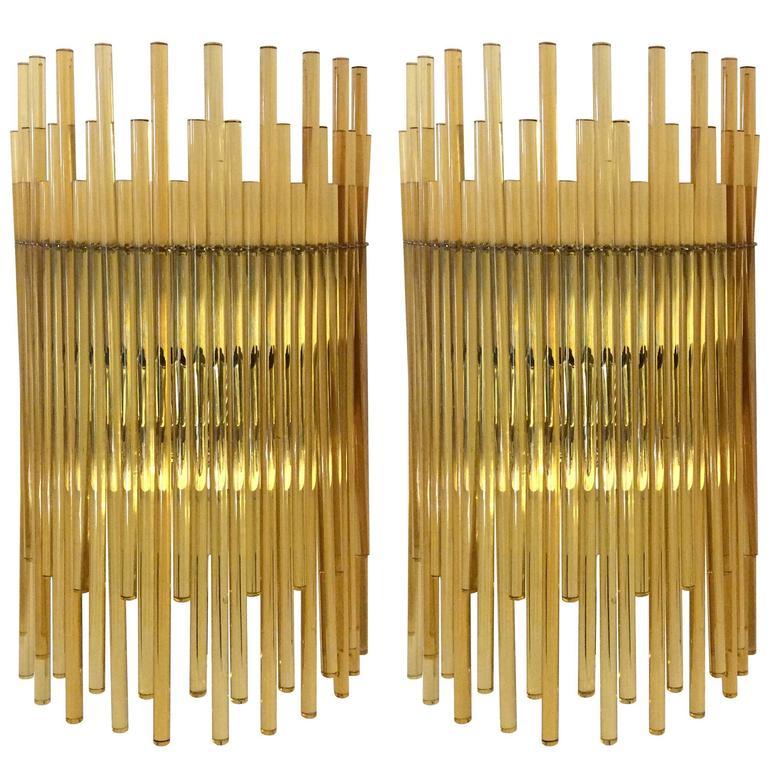 A pair of amber glass sconces with brass backplates and hardware by Gino Vistosi, Italian.