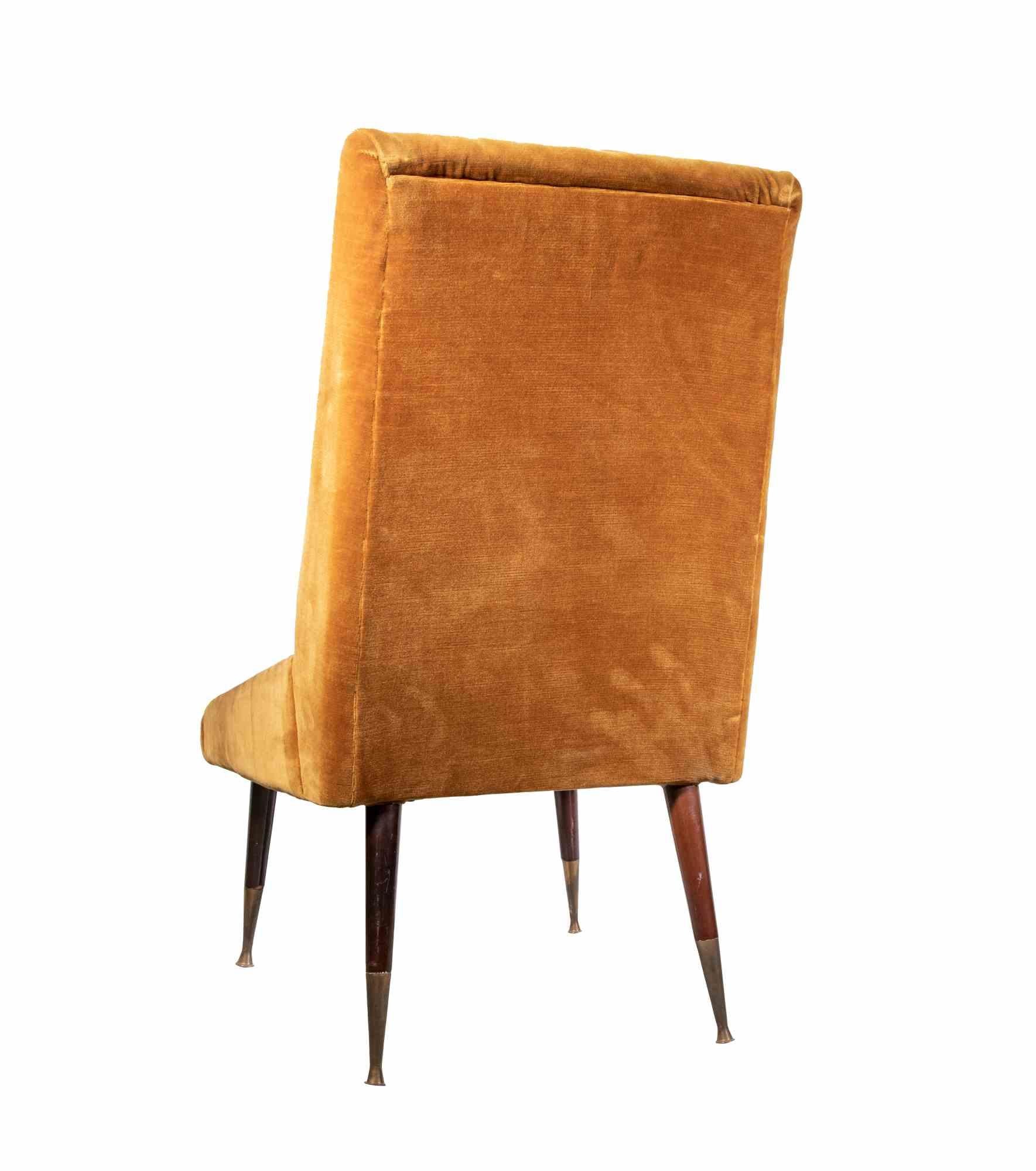 Pair of vintage Armchairs is a contemporary design item realized by Italian Production manufacturer in the 1950s.

A pair of ocher colored armchair realized in wood, brass and Velvet. 

Very good condition.

A vintage object perfect to decor