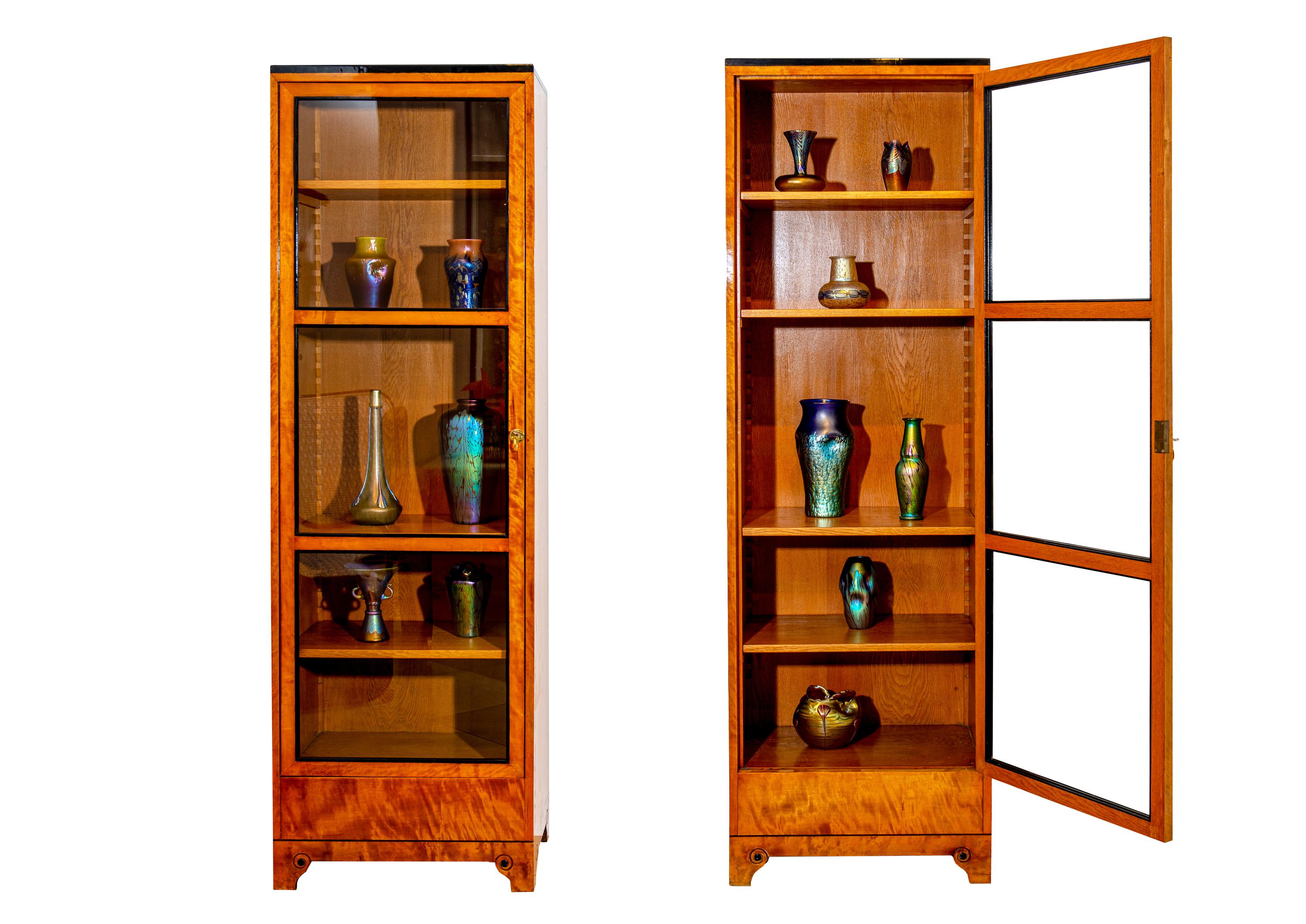 Pair of Vitrines Bruno Paul Austrian Jugendstil Birch and ebonized Pearwood, circa 1907 manufactured by the Vereinigte Werkstatten fur Kunst im Handwerk Munchen

Committed to the idea of bringing together art and craftsmanship in high-quality