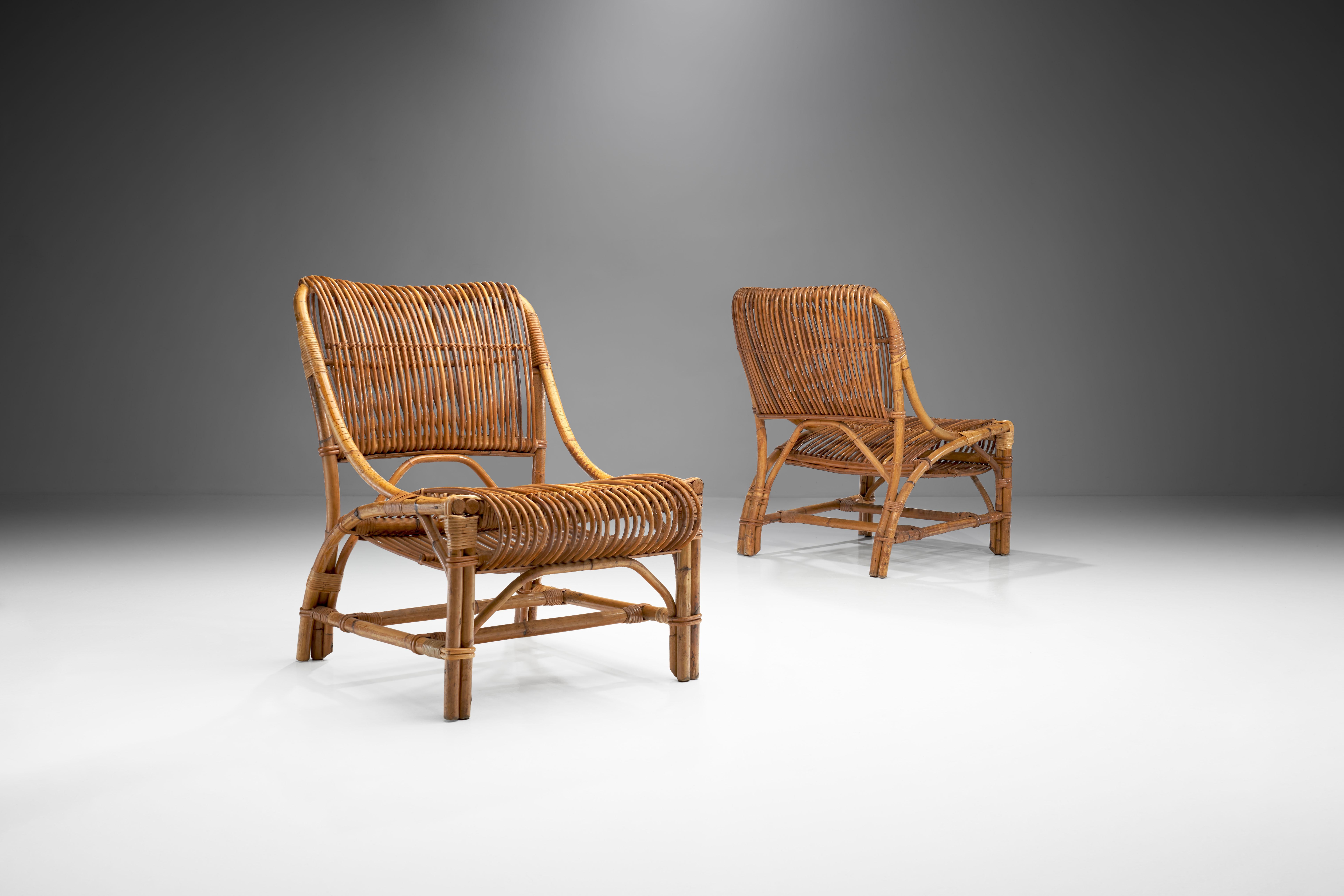 This pair of woven wicker chairs were designed by Vittorio Bonacina from the family-run Bonacina atelier, one of the handful of the surviving rattan ateliers in Europe. Bonacina has been weaving furniture according to the old, traditional techniques